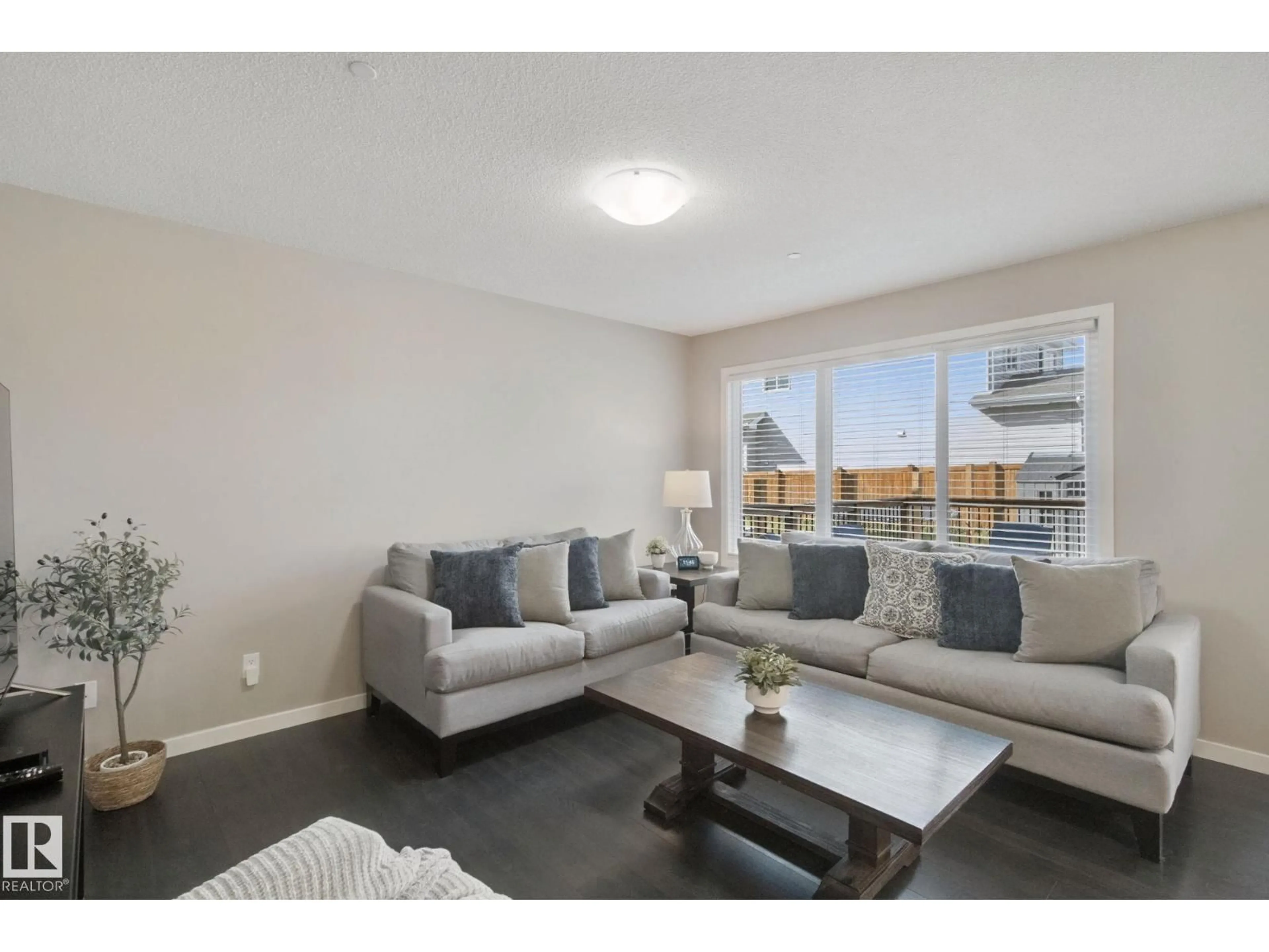 Living room with furniture, wood/laminate floor for 1734 WESTERRA LO, Stony Plain Alberta T7Z0K8