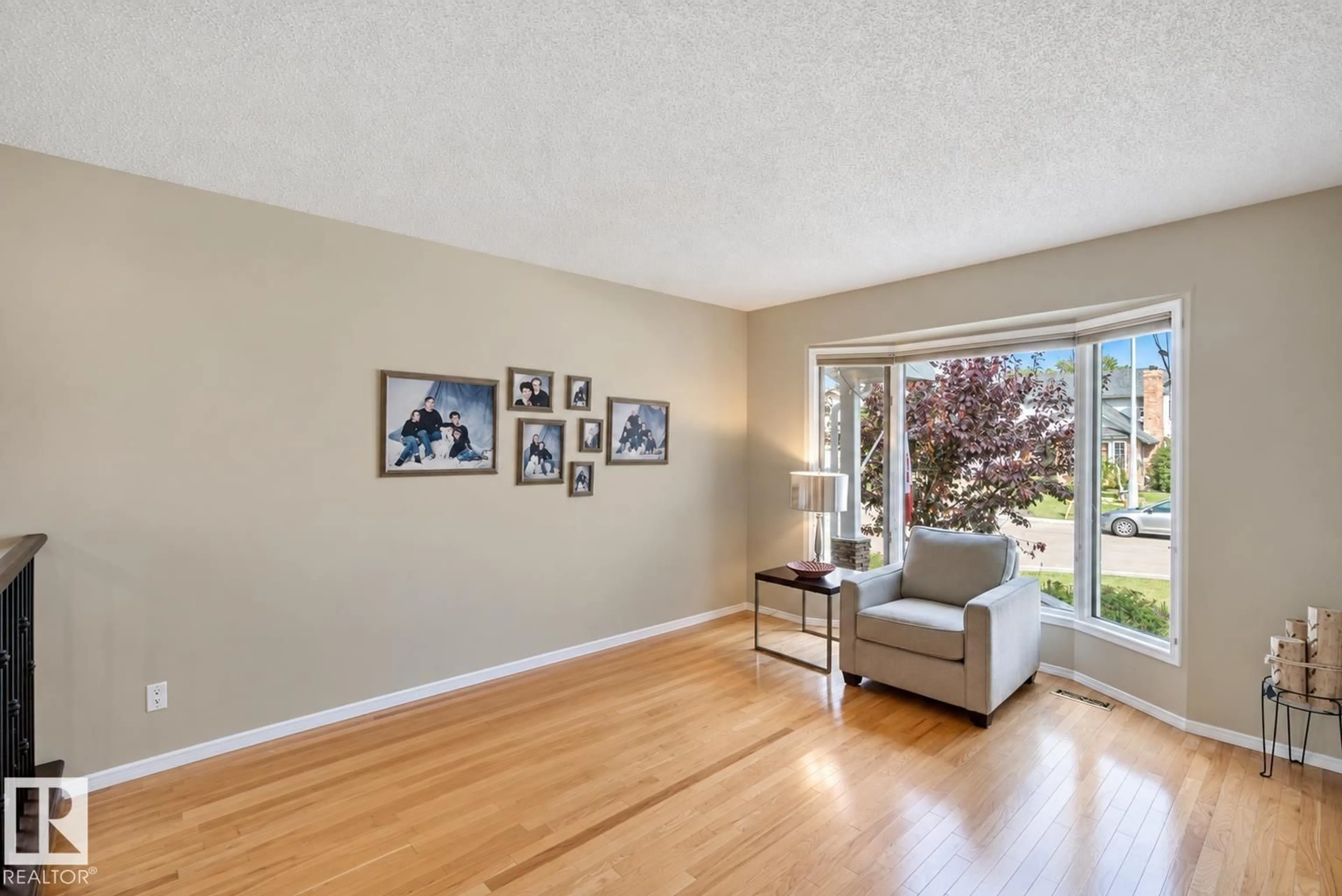 Living room with furniture, wood/laminate floor for 2 STONESHIRE CL, Spruce Grove Alberta T7X3E1