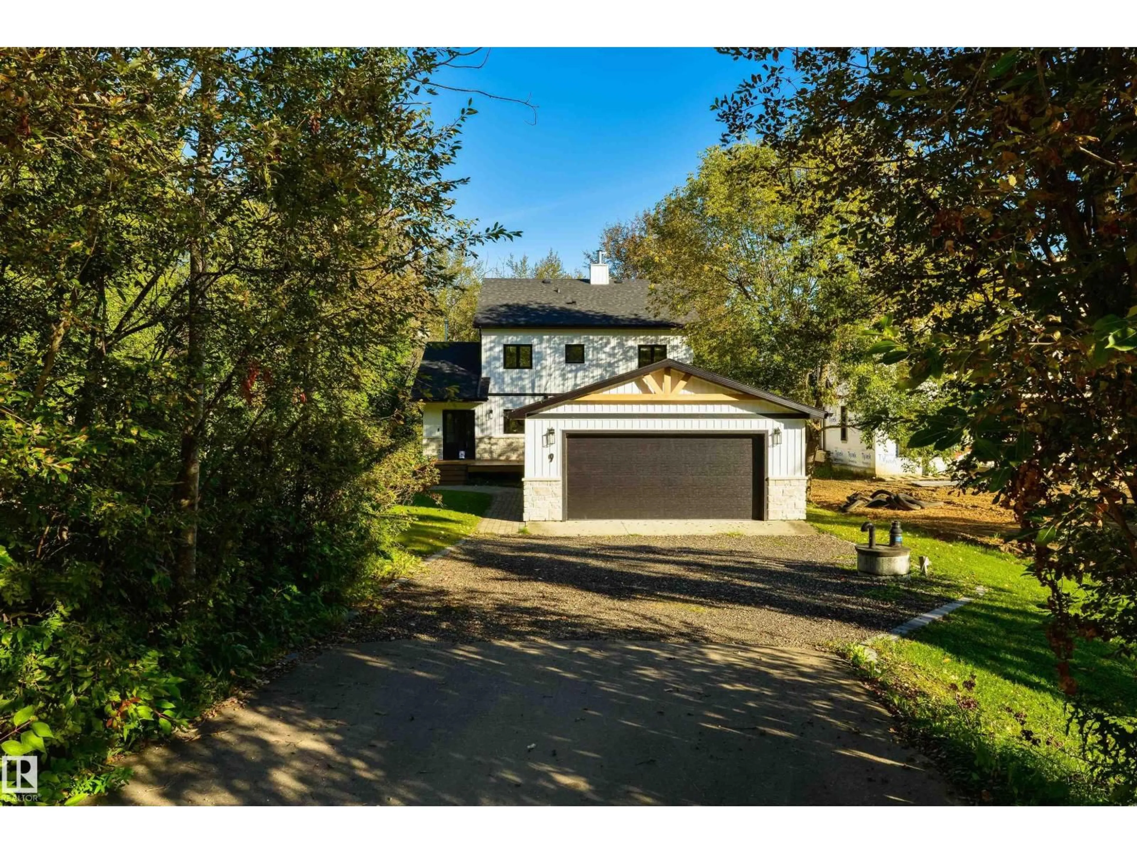 A pic from outside/outdoor area/front of a property/back of a property/a pic from drone, street for #9 - 2307 TWP ROAD 522, Rural Parkland County Alberta T7Y3L7