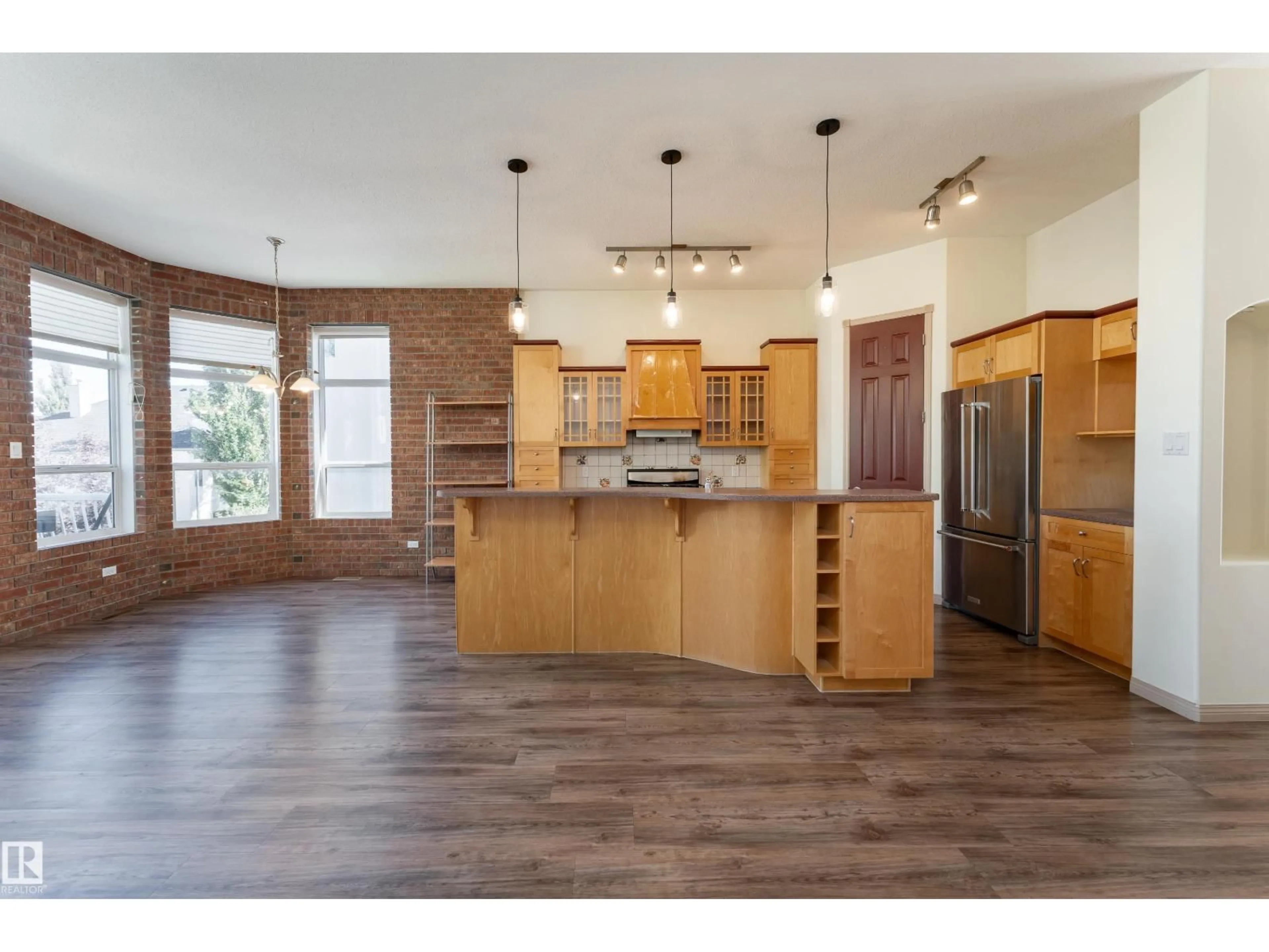 Open concept kitchen, wood/laminate floor for 1462 LOEWEN CT, Edmonton Alberta T6R2Y1