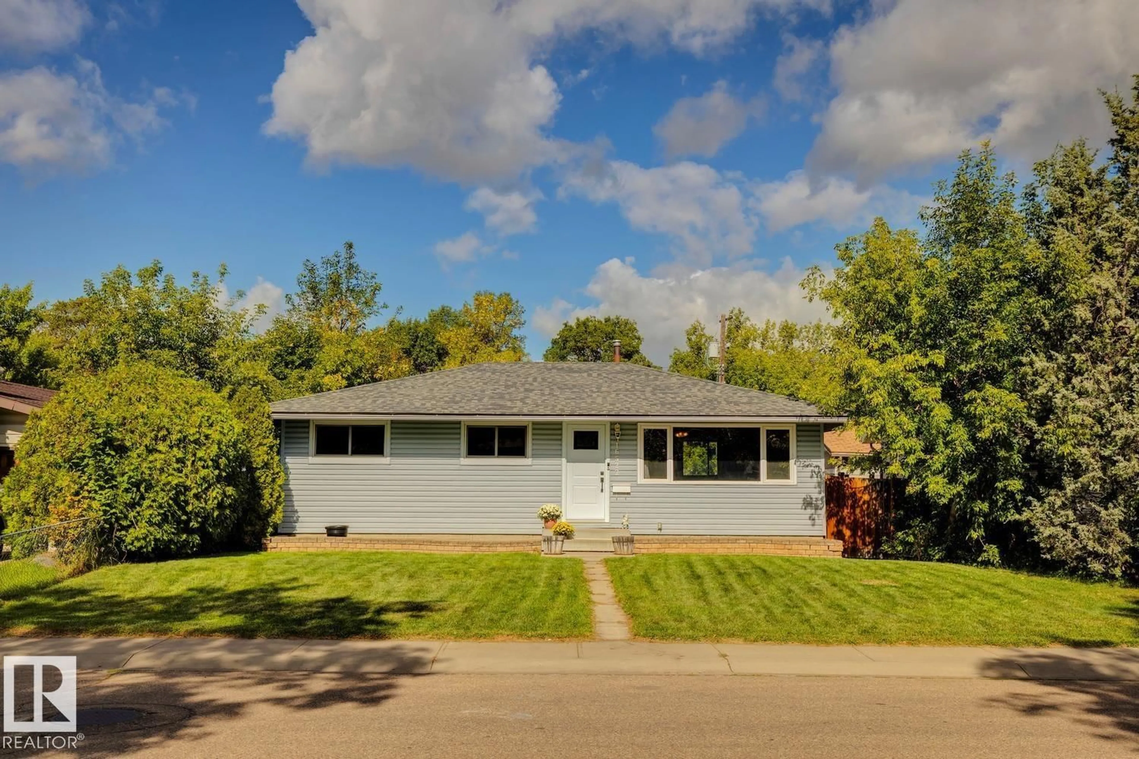 Home with vinyl exterior material, street for 16522 104 AV, Edmonton Alberta T5P0S7