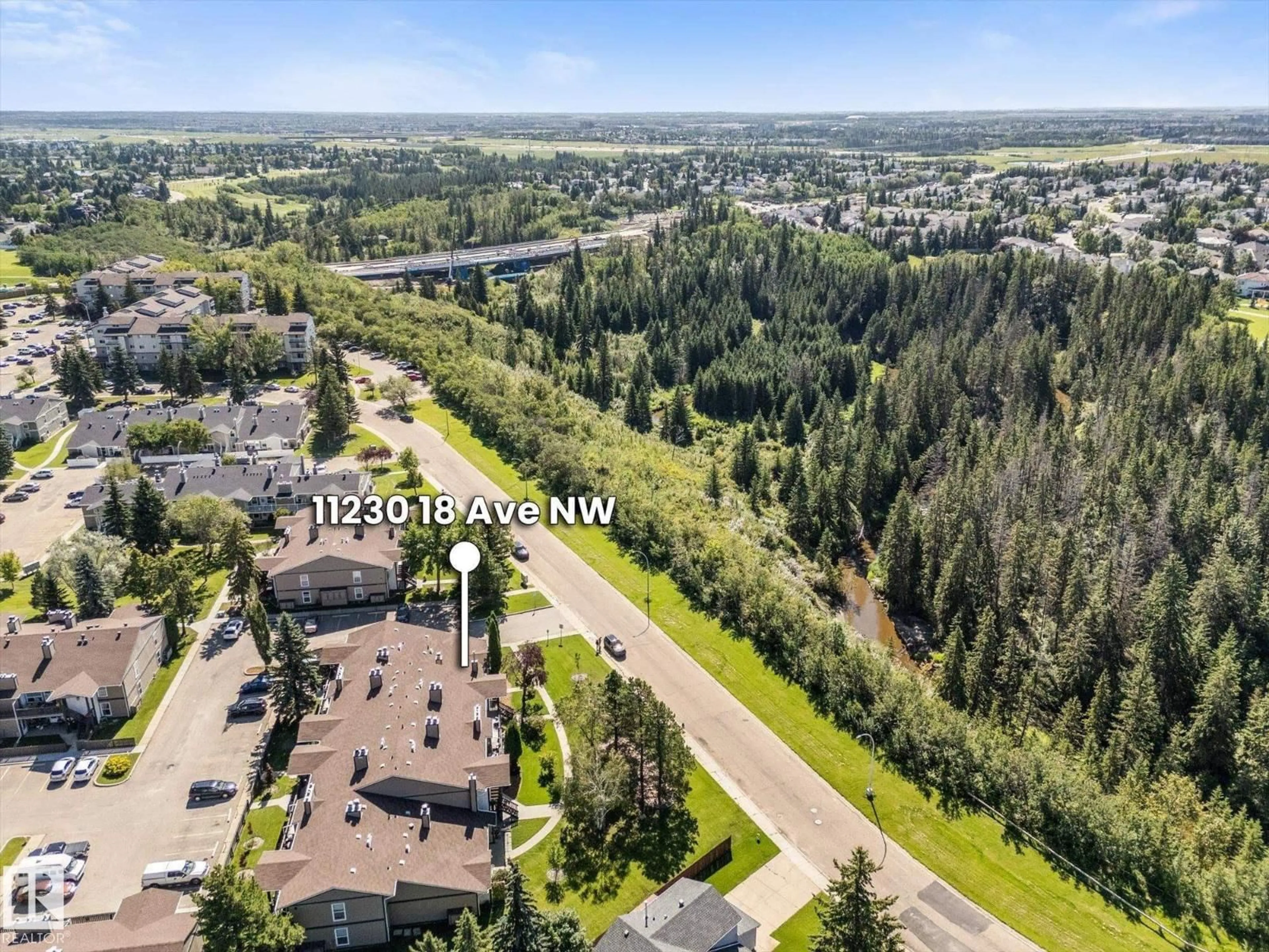 A pic from outside/outdoor area/front of a property/back of a property/a pic from drone, water/lake/river/ocean view for 11230 18 AV, Edmonton Alberta T6J4T9