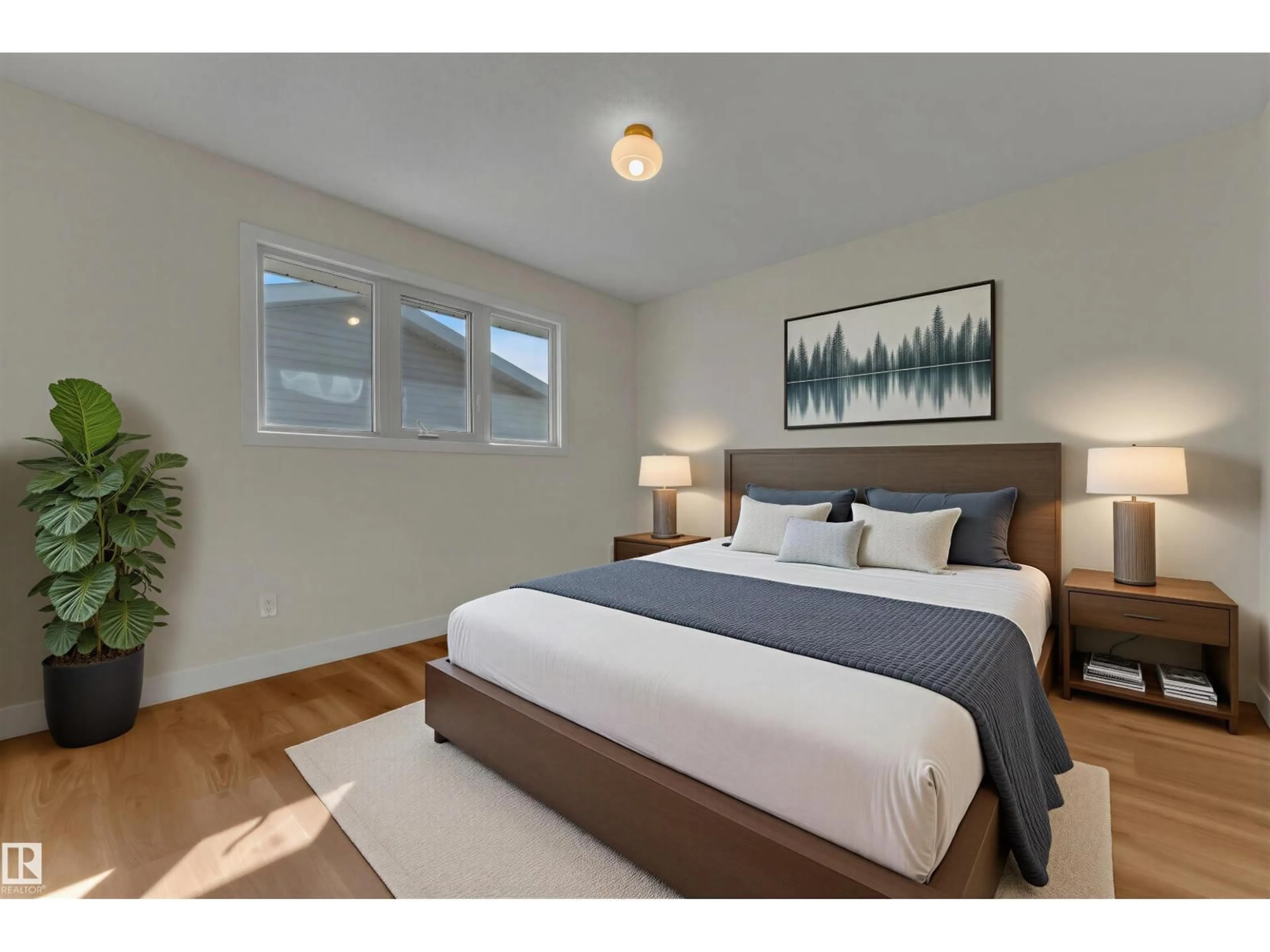 Bedroom with bed, wood/laminate floor for 11427 141 AV, Edmonton Alberta T5X3Z7