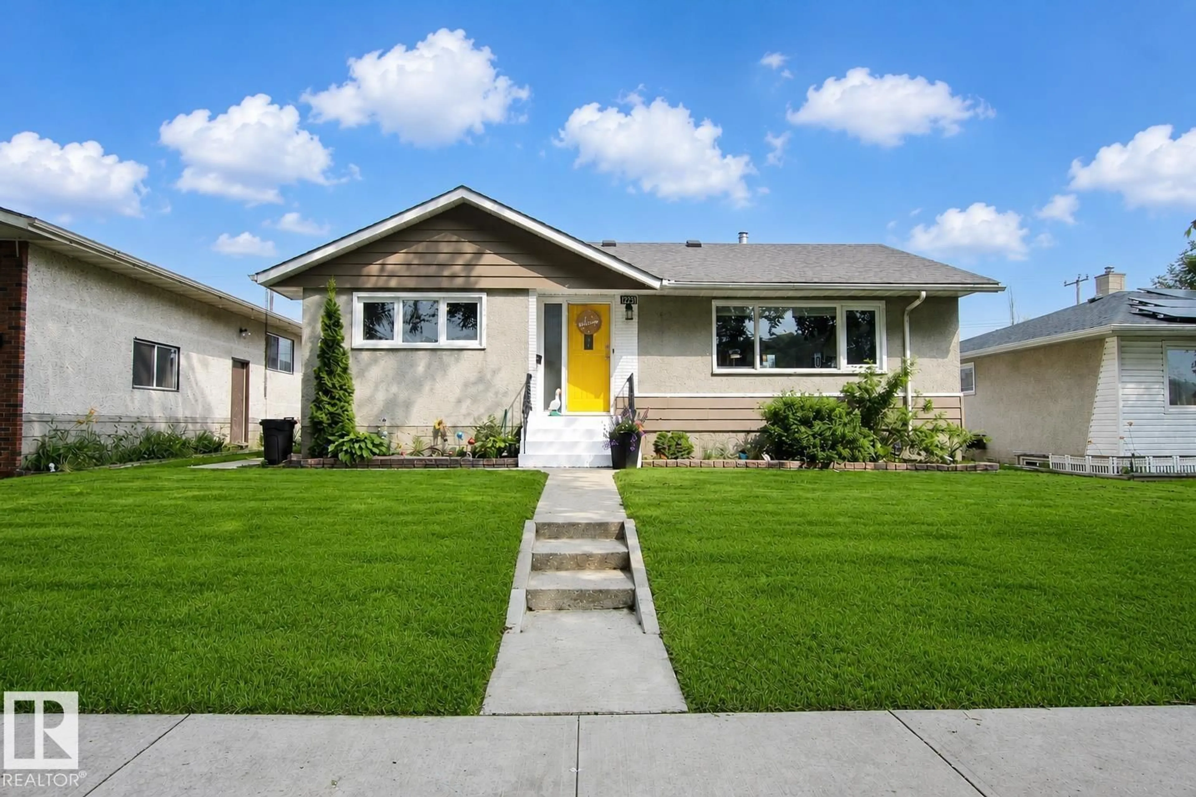 Home with vinyl exterior material, street for 12231 55 ST, Edmonton Alberta T5W3R5