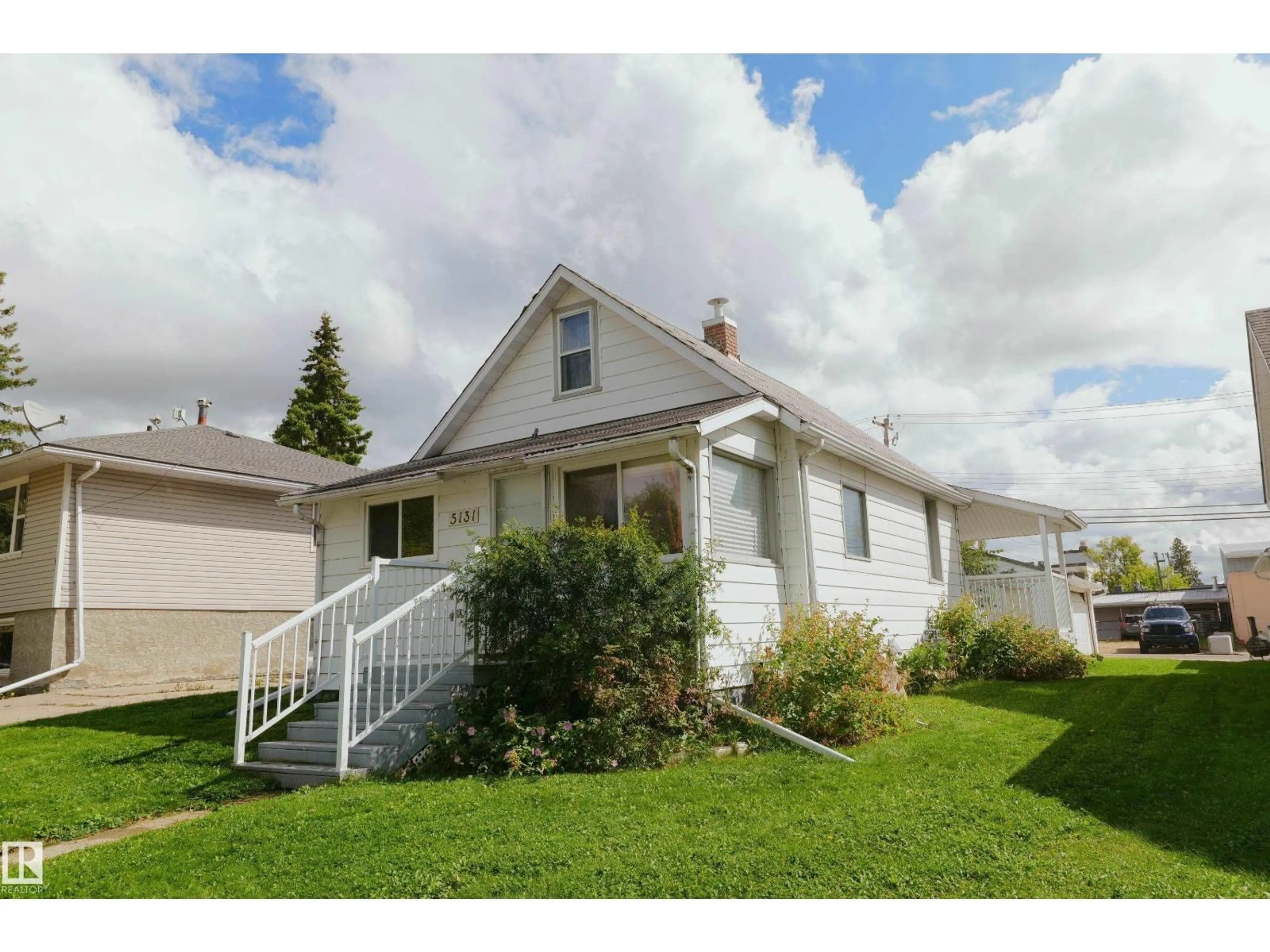 Home with vinyl exterior material, street for 5131 51 STREET, Barrhead Alberta T7N1A5