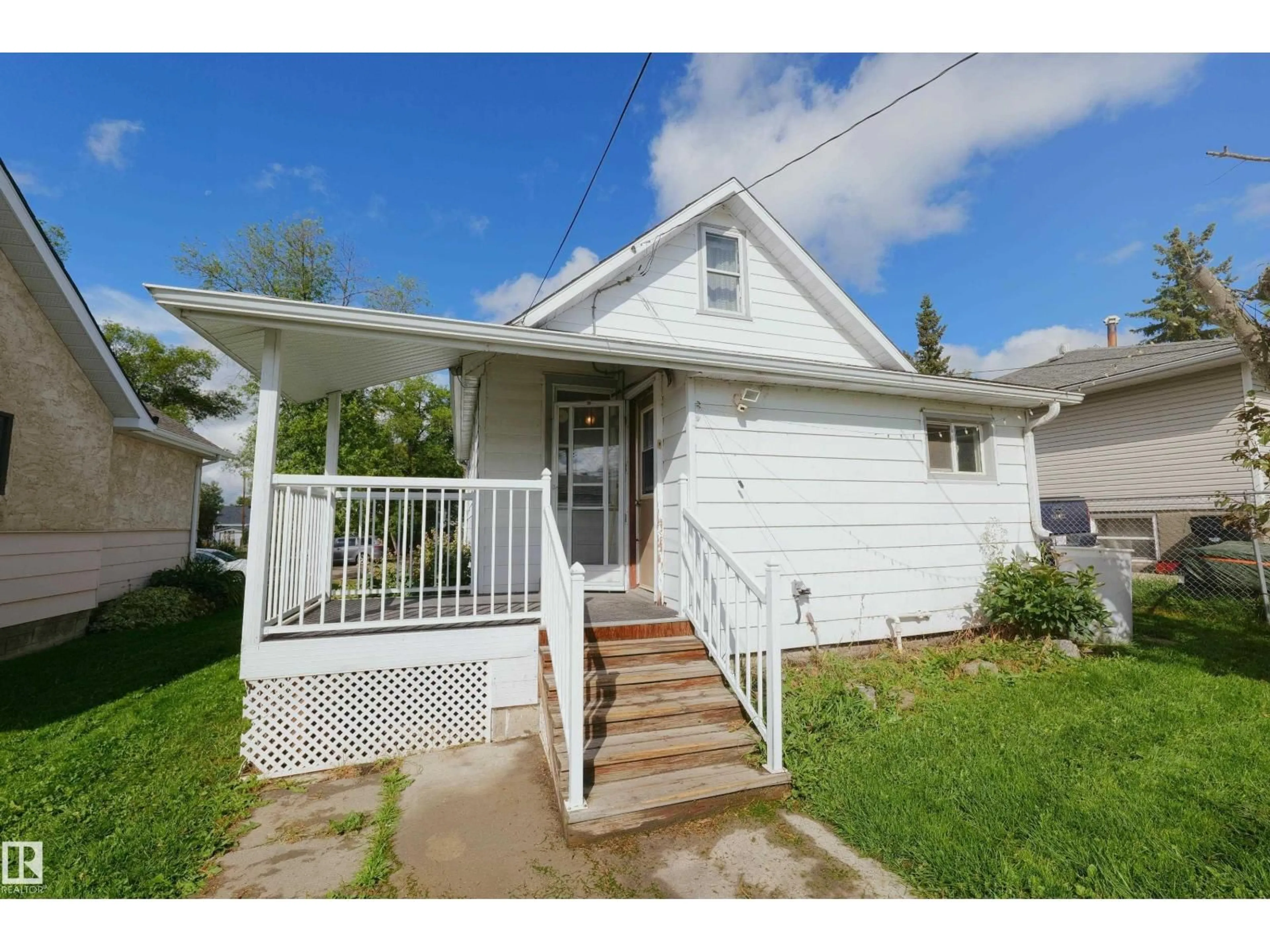 Home with vinyl exterior material, street for 5131 51 STREET, Barrhead Alberta T7N1A5