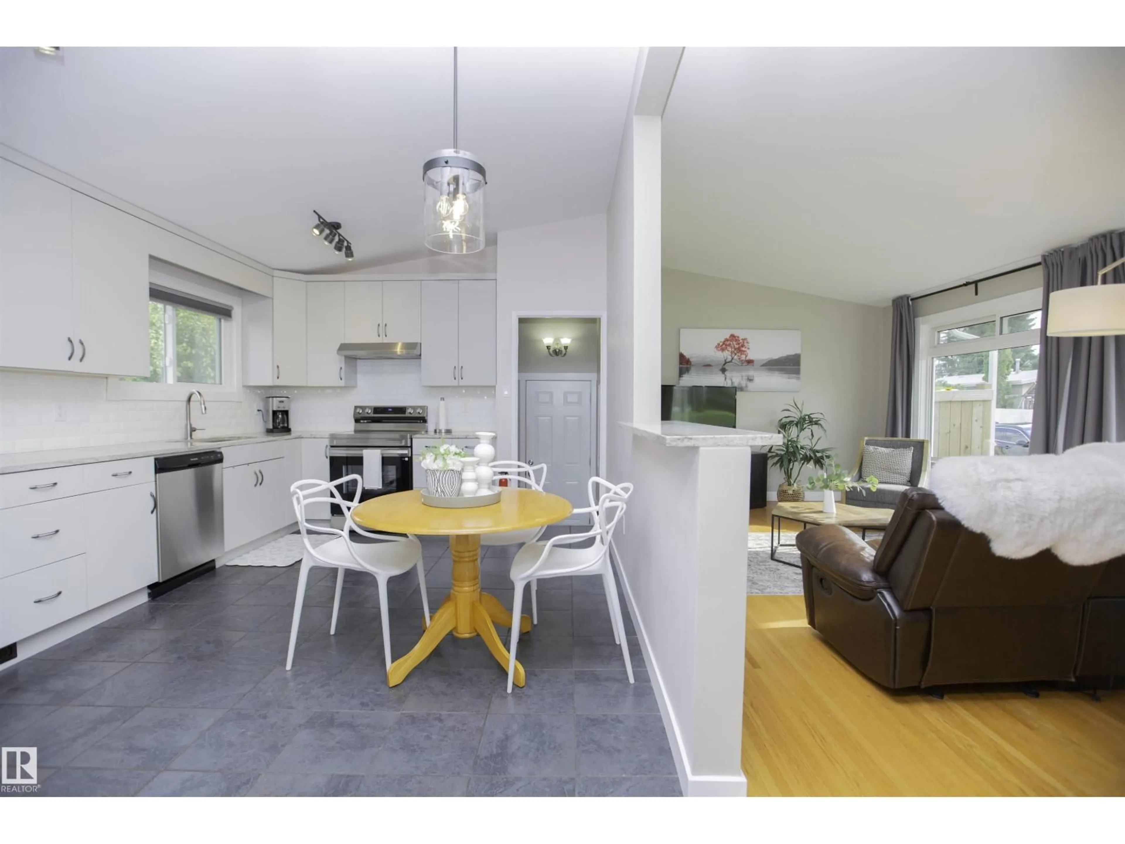 Open concept kitchen, wood/laminate floor for NW - 9107 58 ST, Edmonton Alberta T6B1L3