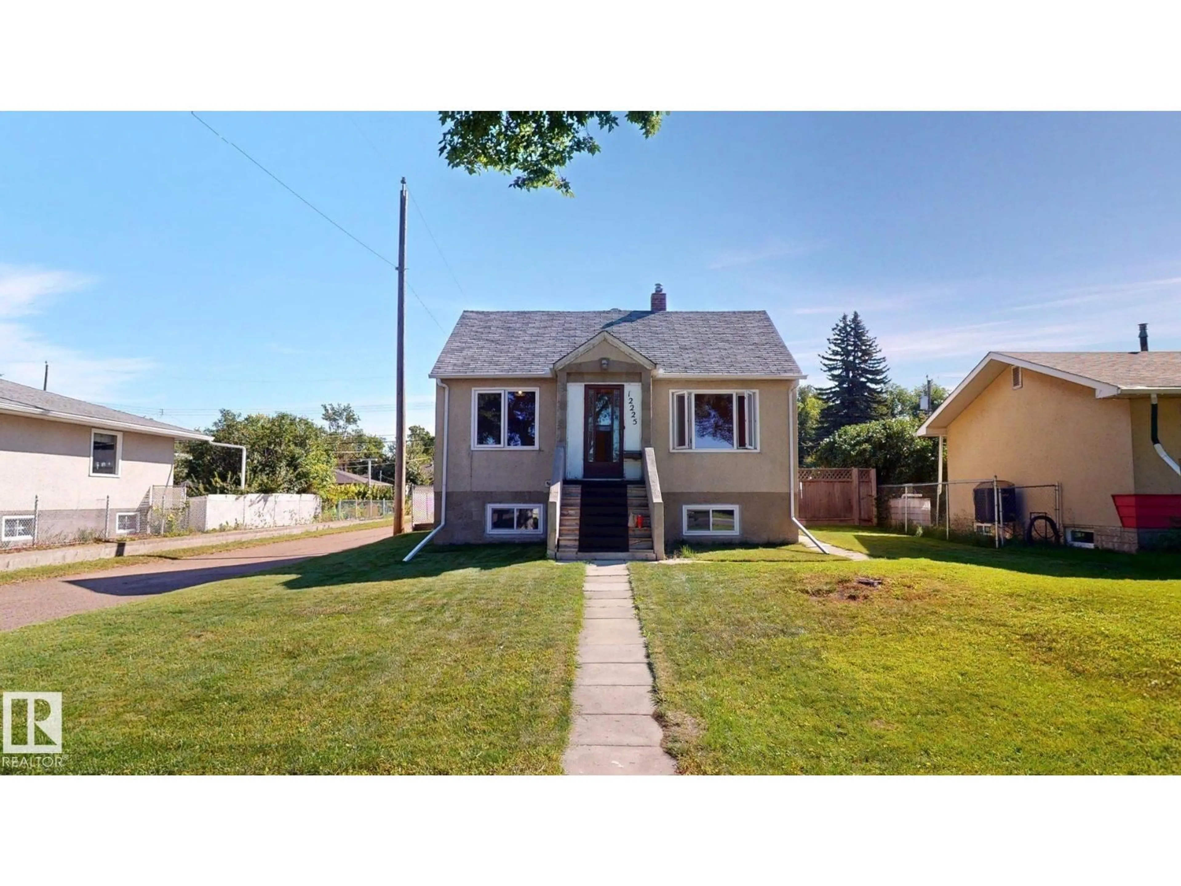 Home with vinyl exterior material, street for 12225 81 ST, Edmonton Alberta T5B2T2