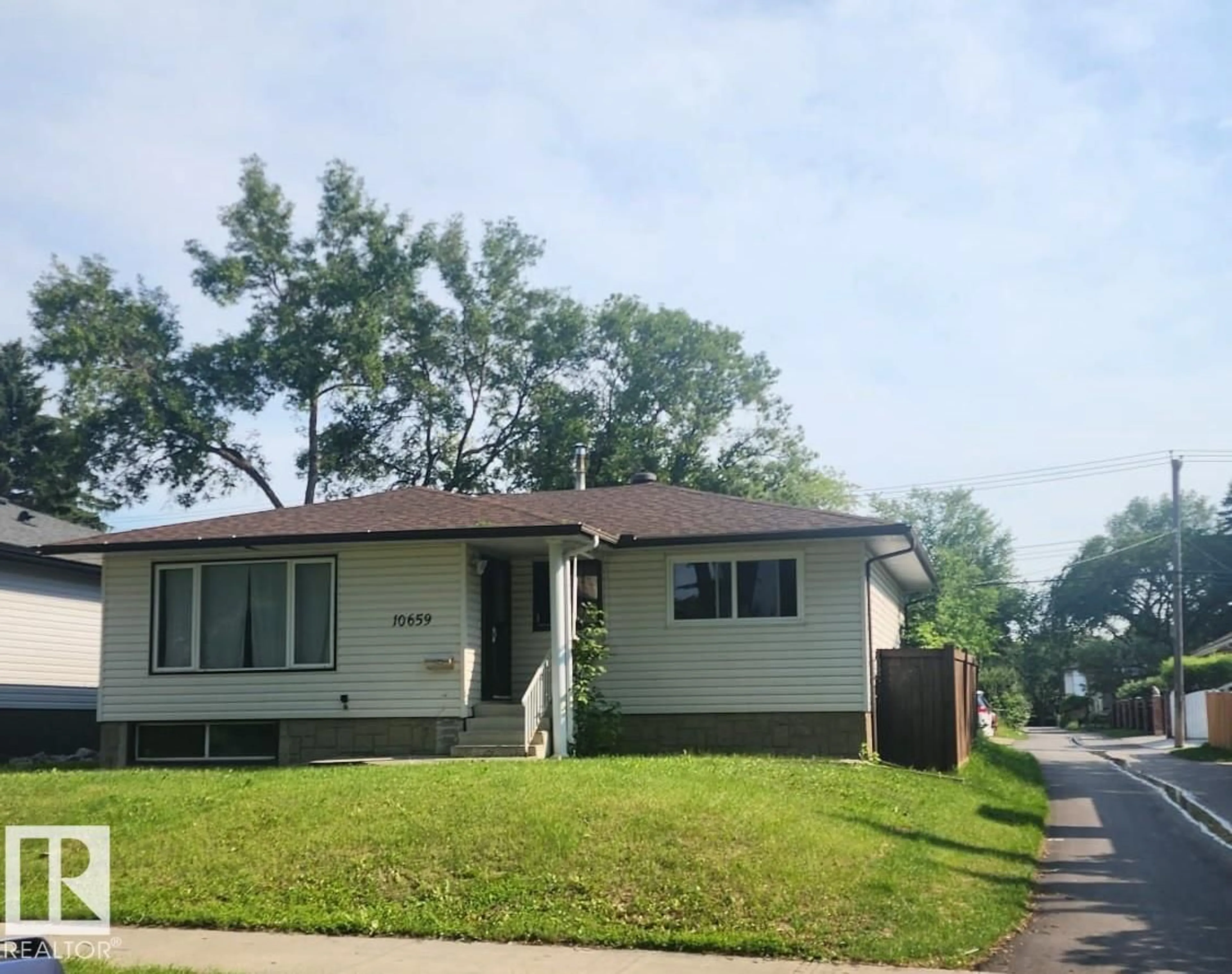 Home with vinyl exterior material, street for 10659 65 AV, Edmonton Alberta T6H1V5
