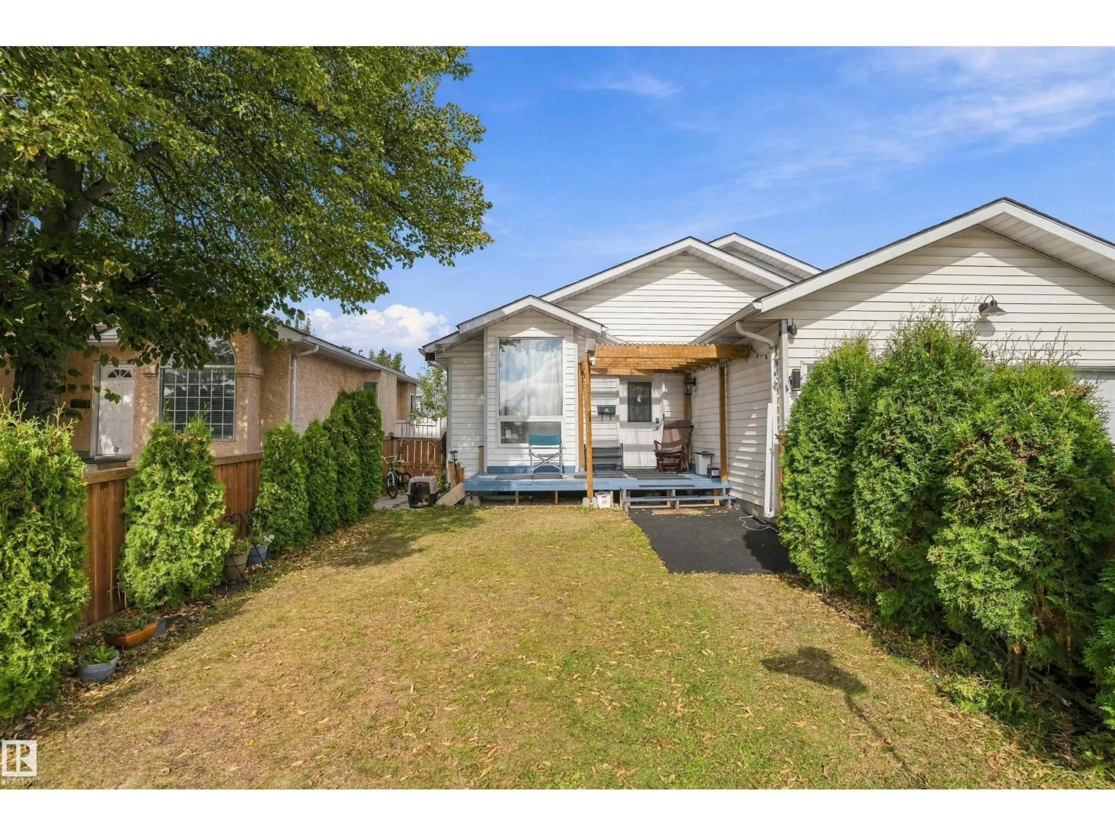 Home with vinyl exterior material, street for 4824 13 AV, Edmonton Alberta T6L6J9