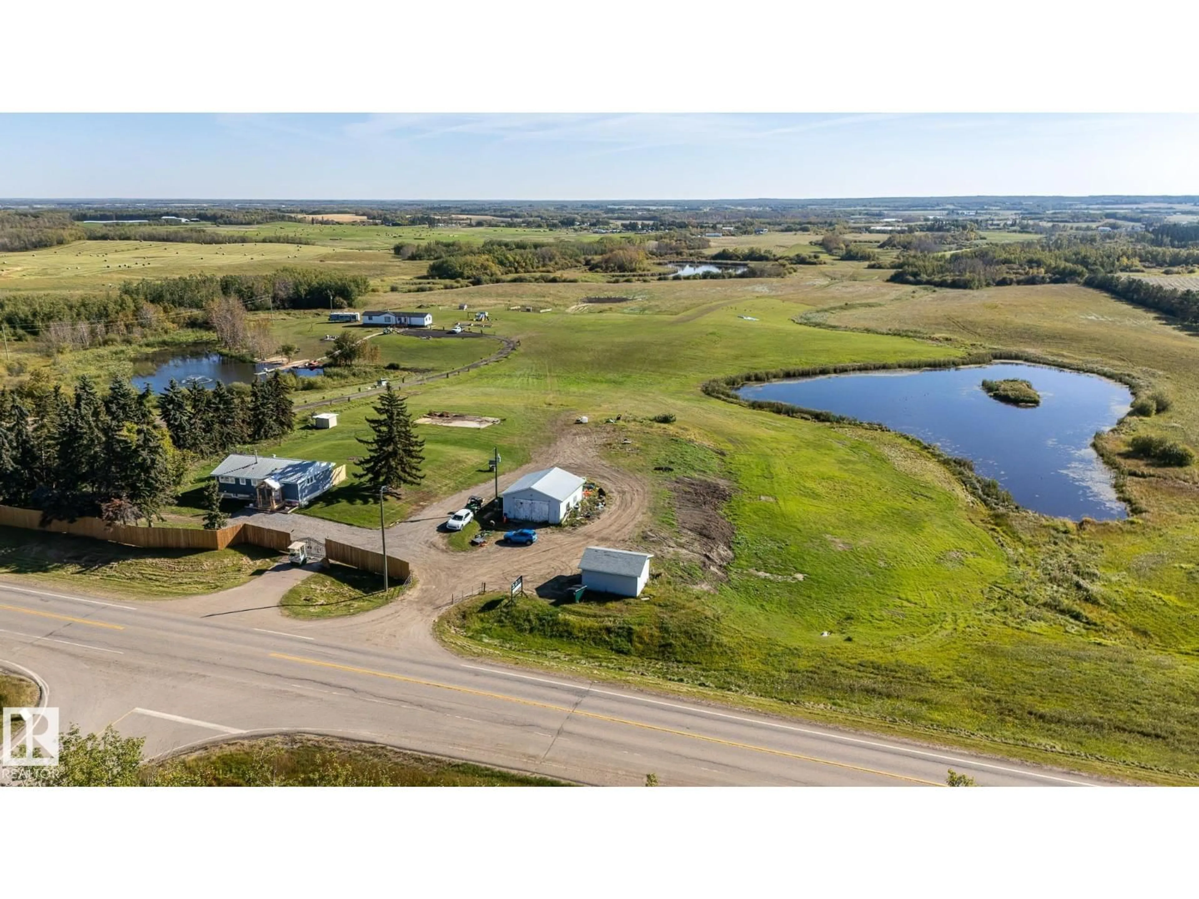 A pic from outside/outdoor area/front of a property/back of a property/a pic from drone, water/lake/river/ocean view for 53273 RGE ROAD 215, Rural Strathcona County Alberta T8E2B4