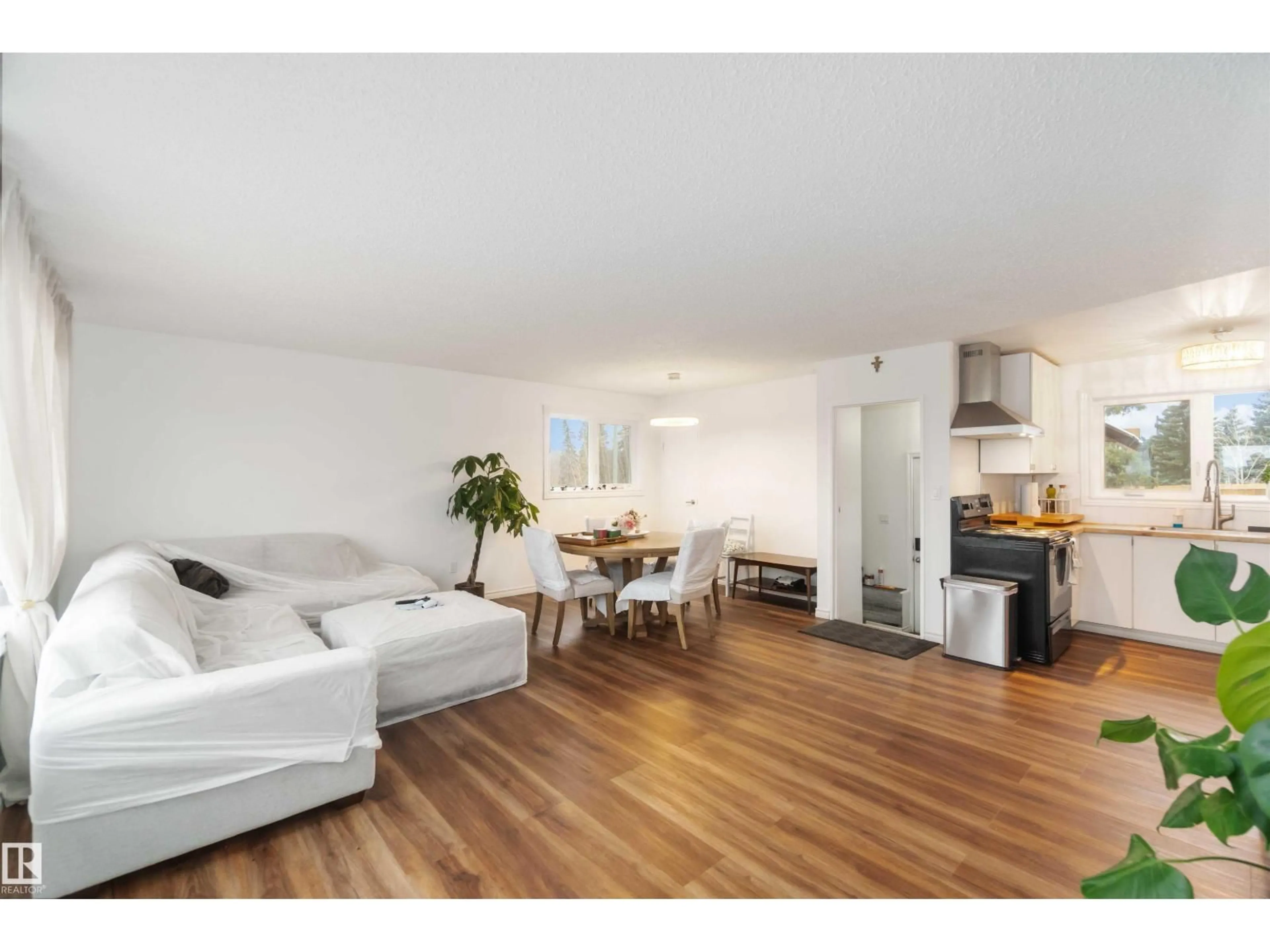 Living room with furniture, wood/laminate floor for 53273 RGE ROAD 215, Rural Strathcona County Alberta T8E2B4