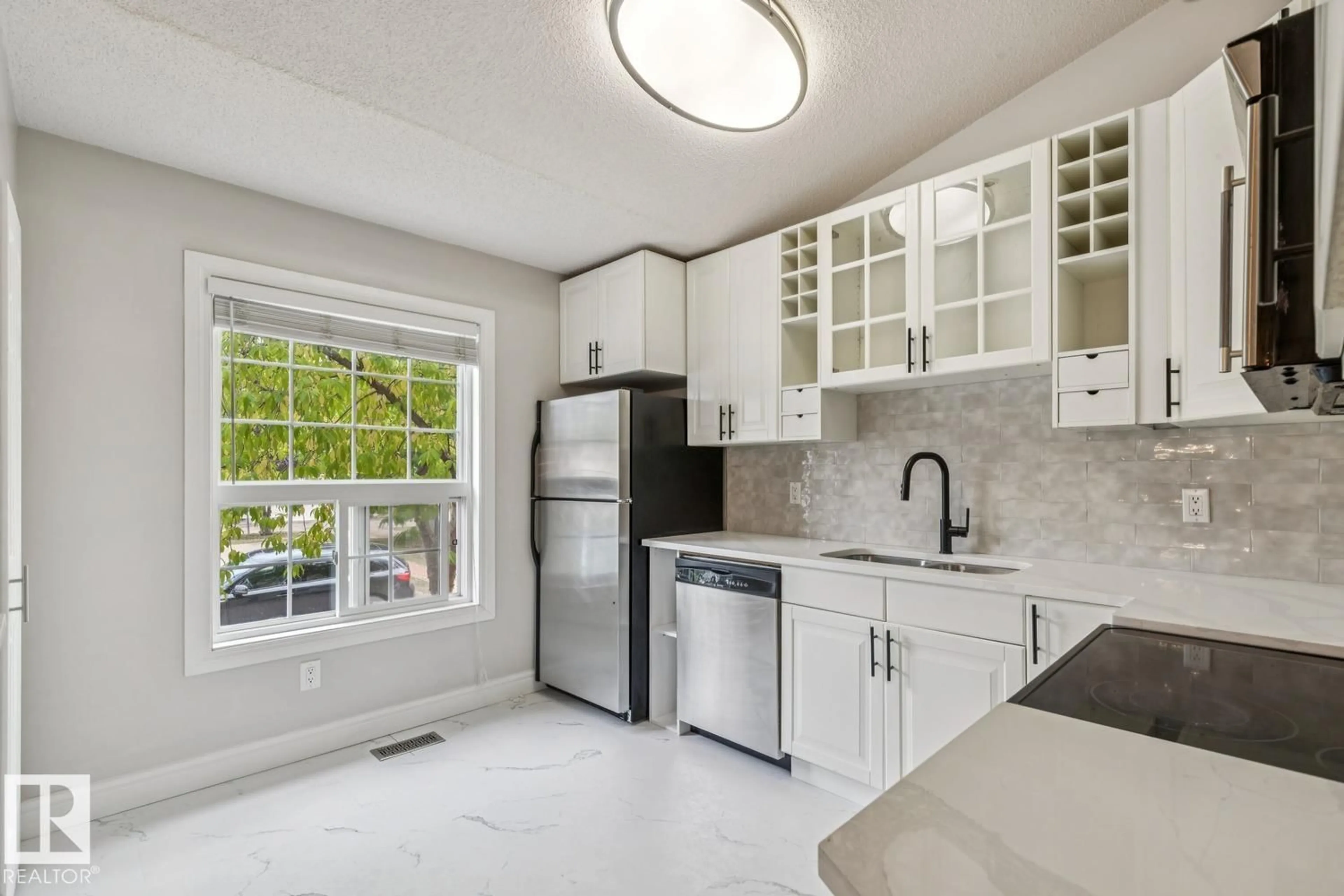 Open concept kitchen, ceramic/tile floor for #30 - 4630 17 AV, Edmonton Alberta T6L6H3