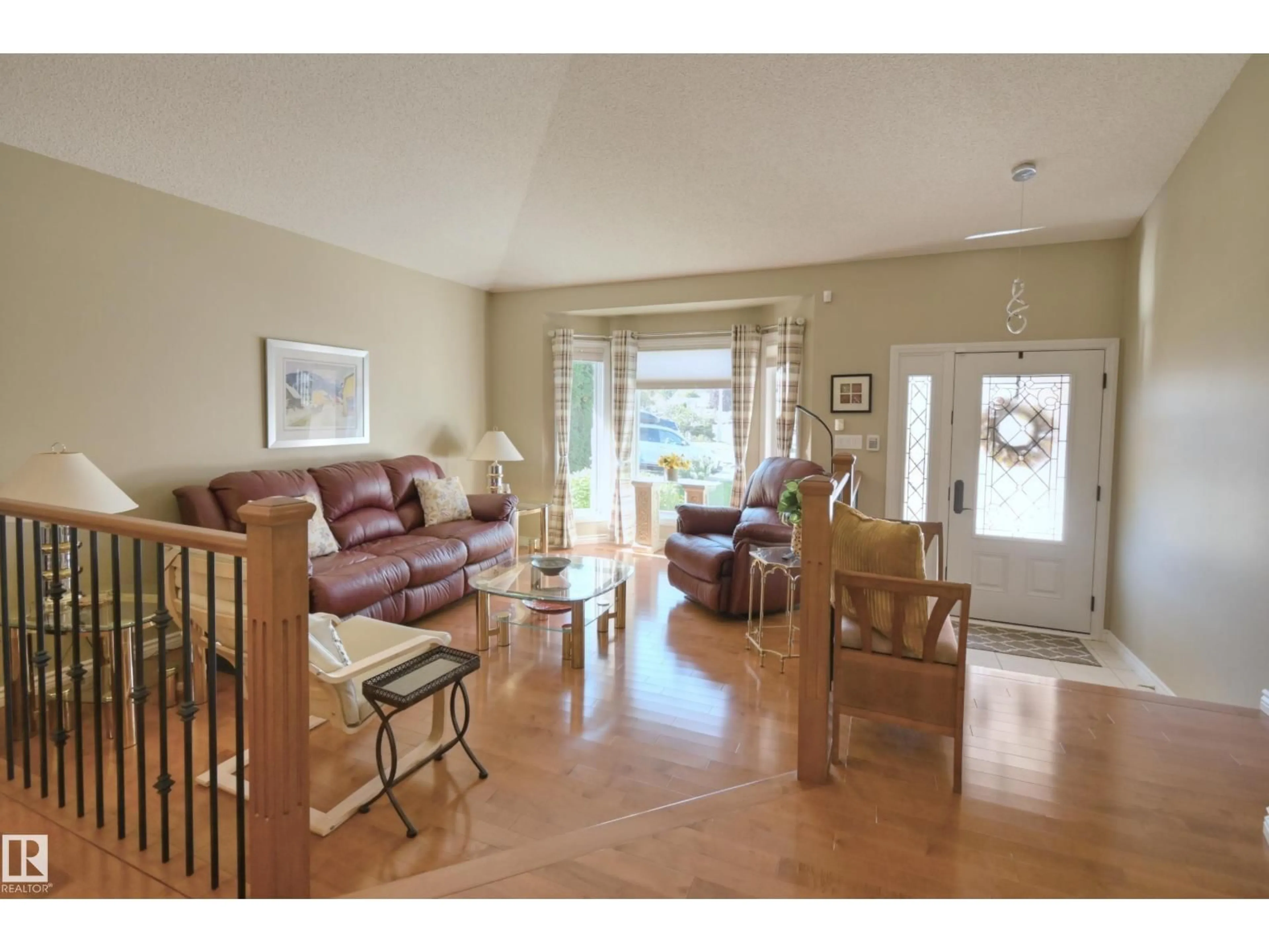 Living room with furniture, wood/laminate floor for 56 STONESHIRE CR, Spruce Grove Alberta T7X3E2