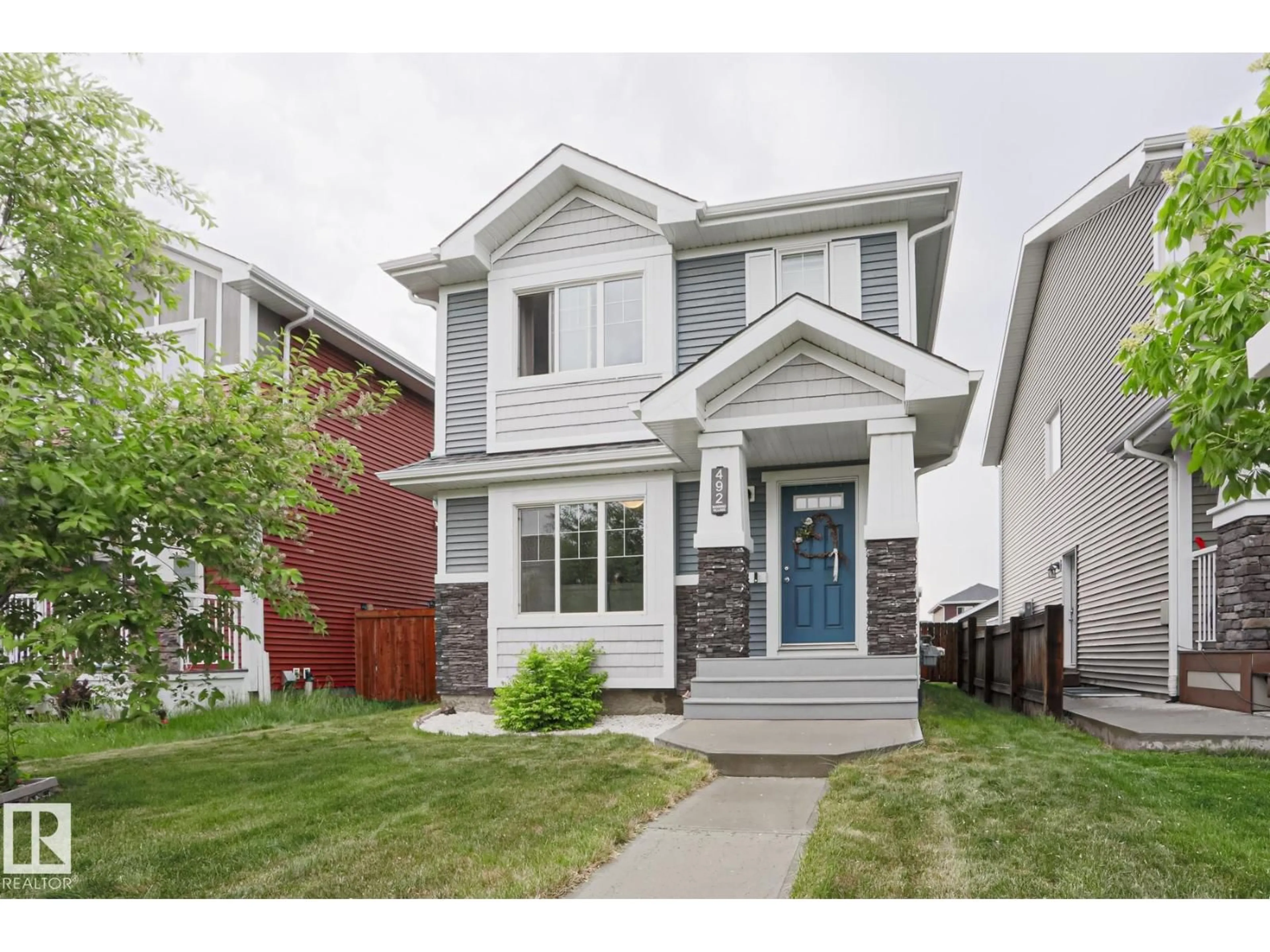 Home with vinyl exterior material, street for 492 EBBERS WY, Edmonton Alberta T5Y3T7