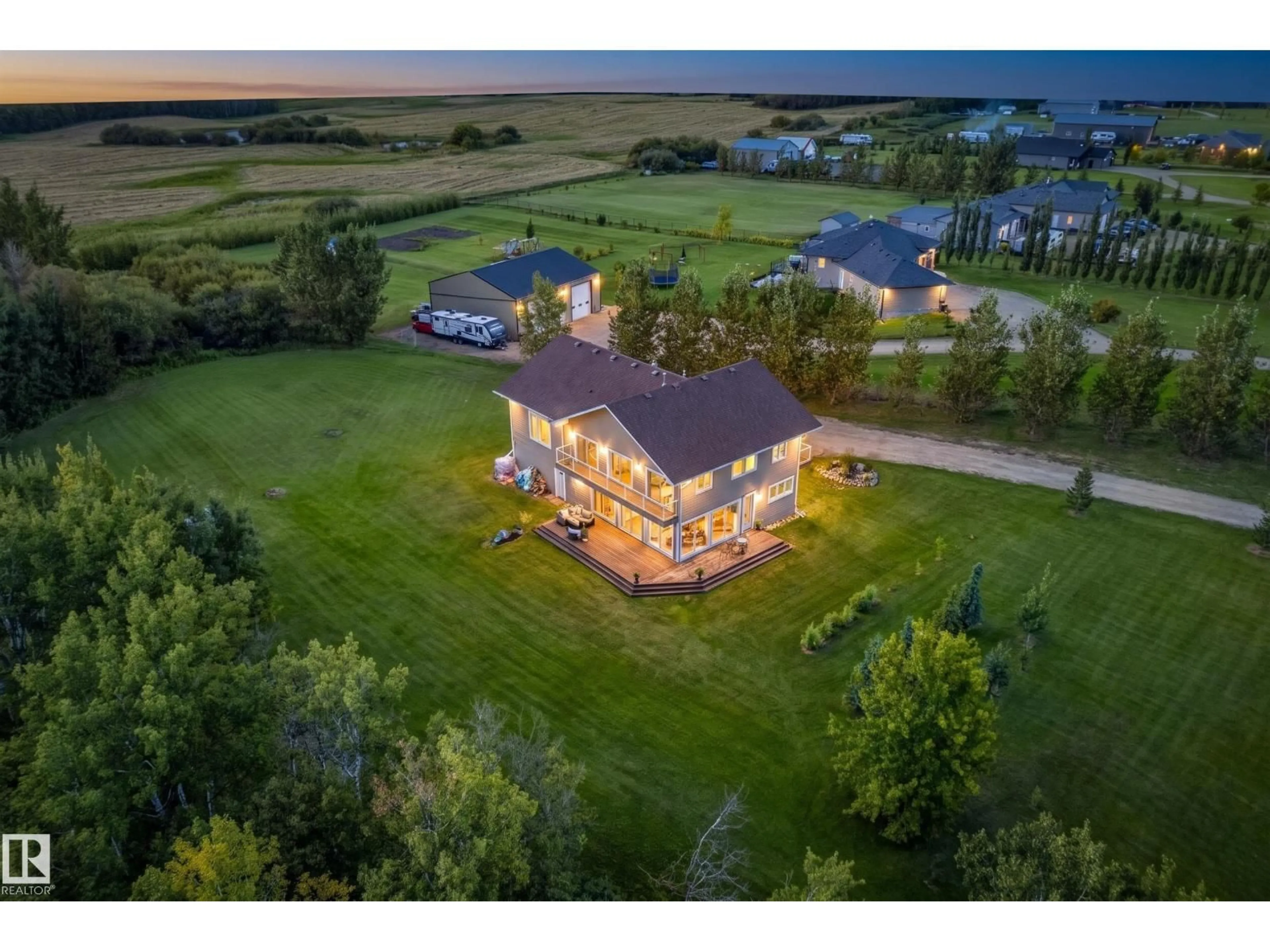 A pic from outside/outdoor area/front of a property/back of a property/a pic from drone, water/lake/river/ocean view for 140 50074 RGE RD 233, Rural Leduc County Alberta T4X0L2