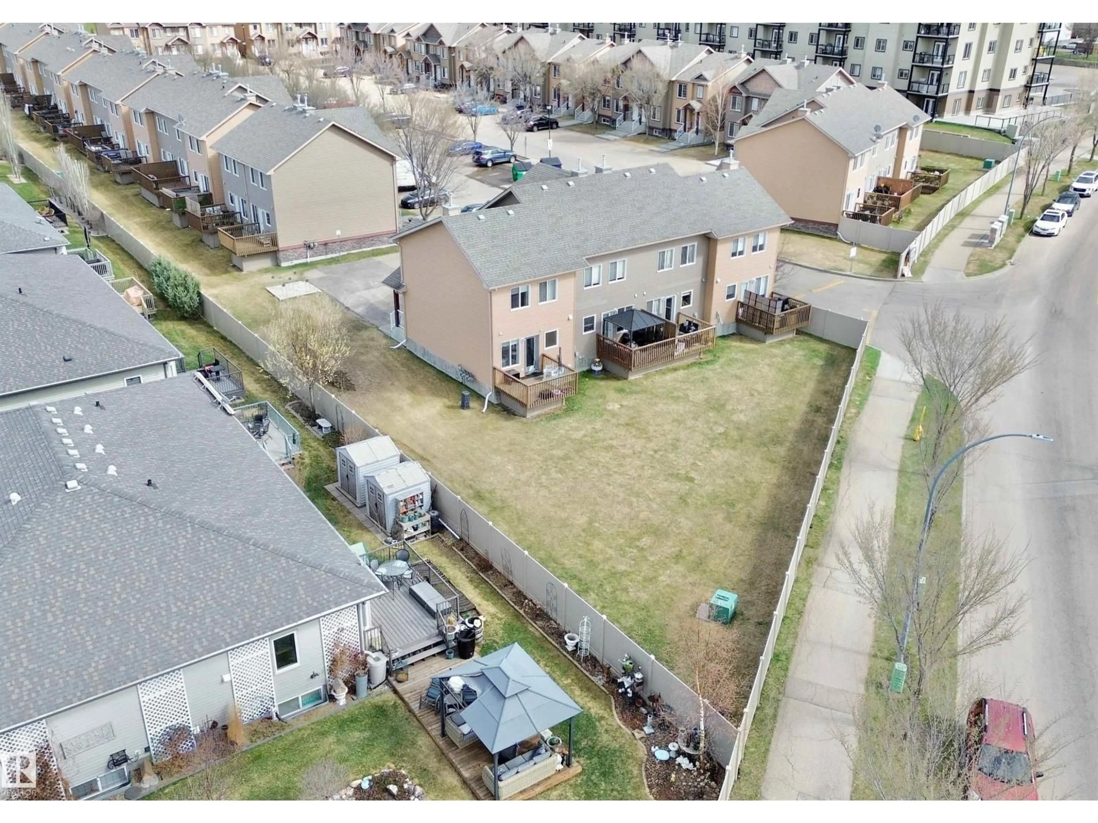 A pic from outside/outdoor area/front of a property/back of a property/a pic from drone, street for #4 - 320 SPRUCE RIDGE RD, Spruce Grove Alberta T7X0H5