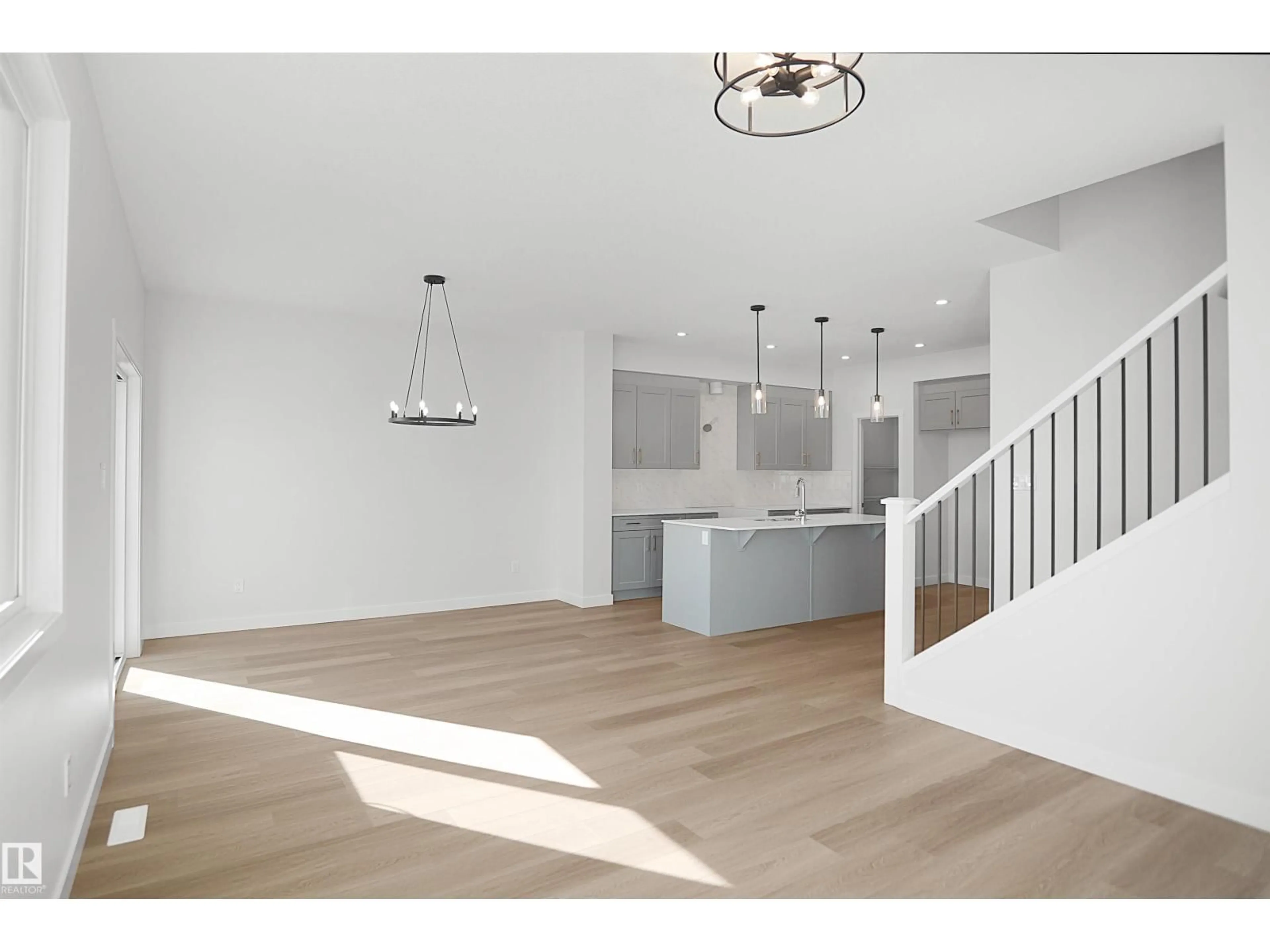 Open concept kitchen, wood/laminate floor for 1015 14 AV, Edmonton Alberta T6T2R6