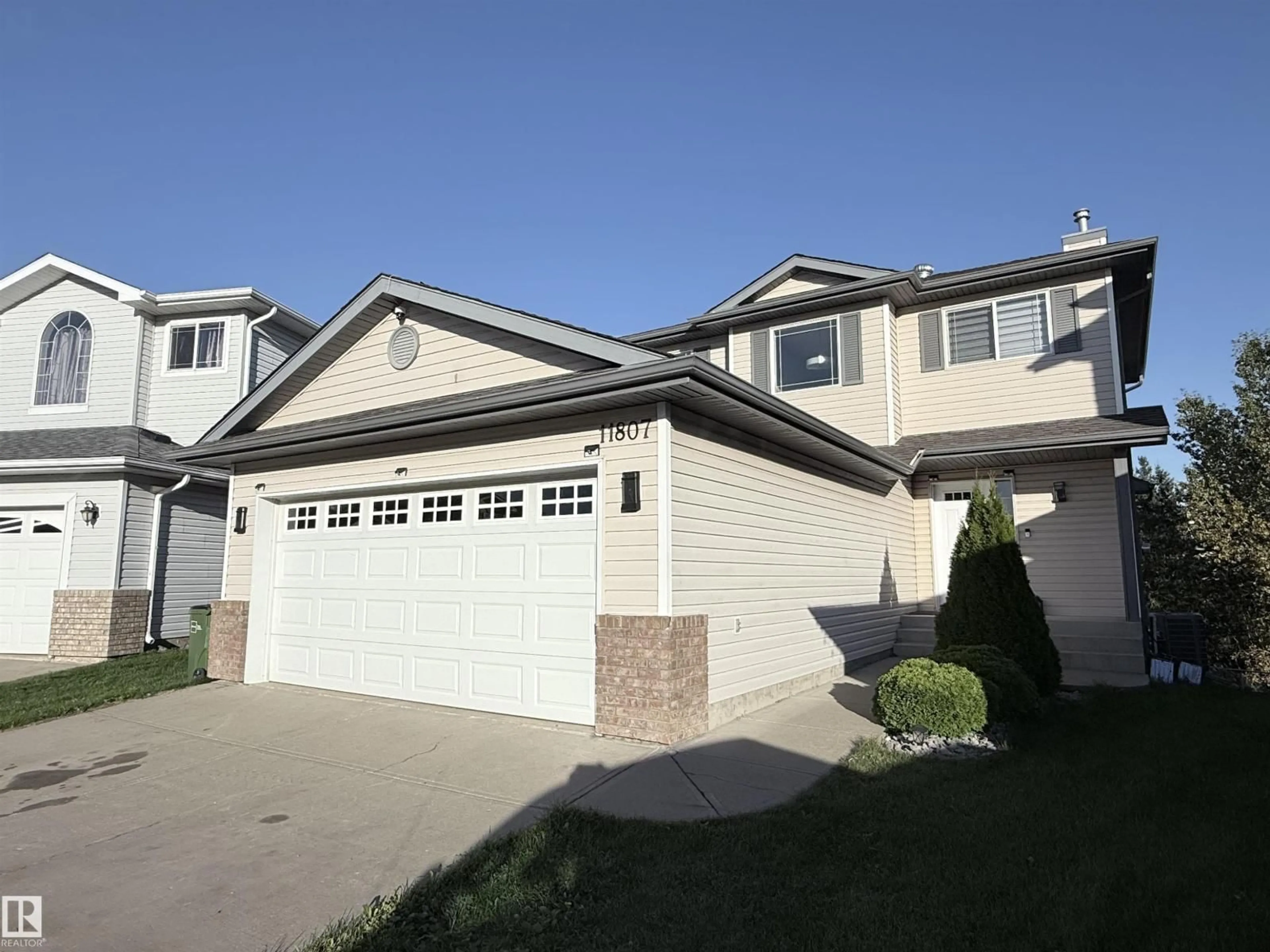 Home with vinyl exterior material, street for 11807 171 AV, Edmonton Alberta T5X6H8