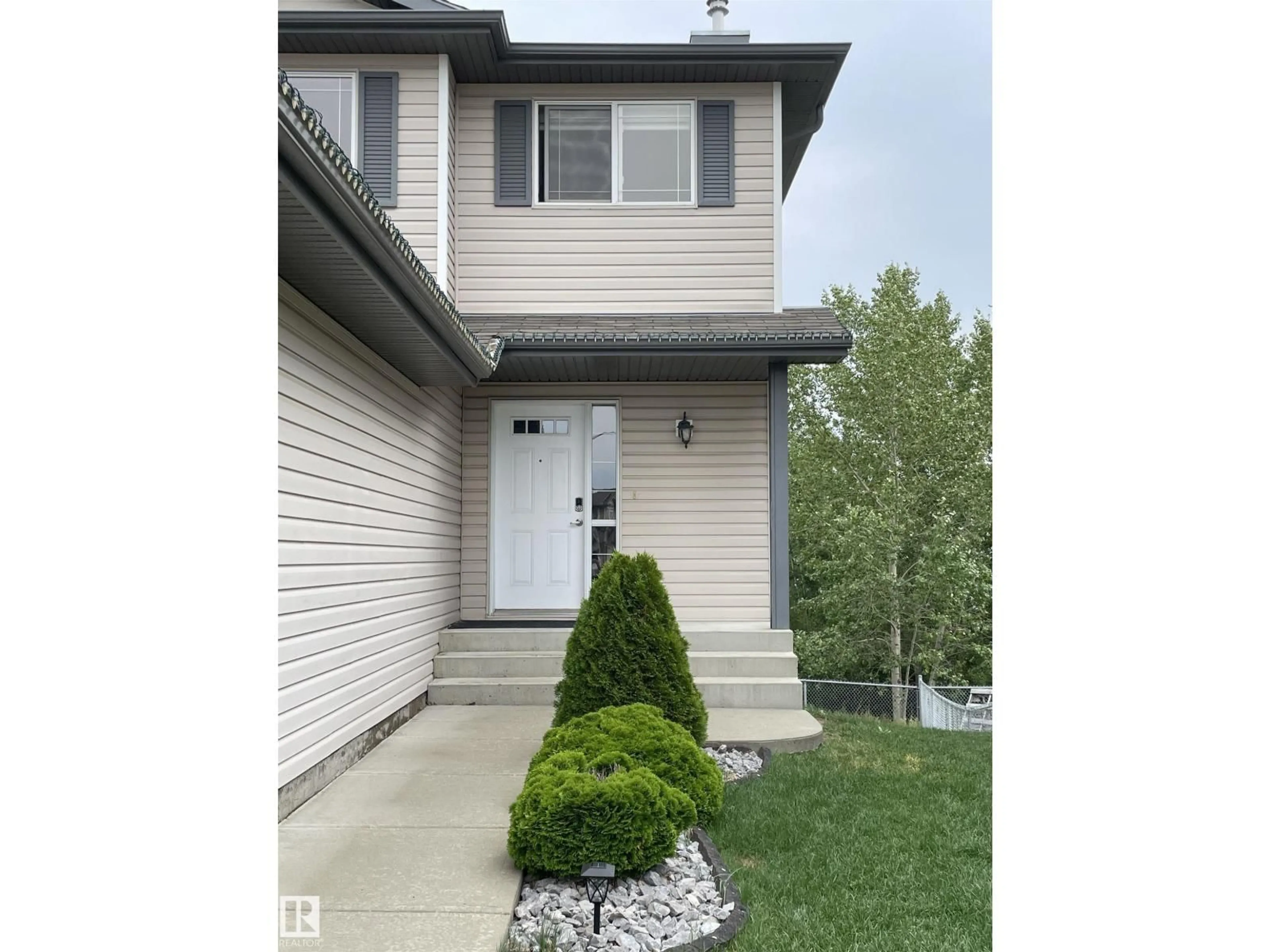 Home with vinyl exterior material, street for 11807 171 AV, Edmonton Alberta T5X6H8
