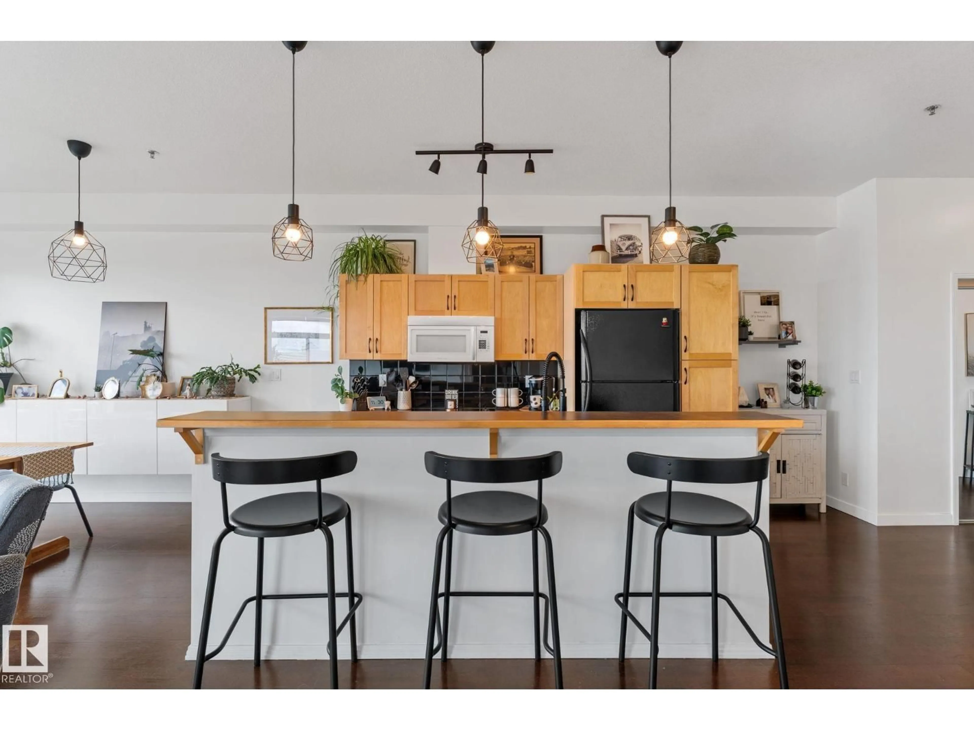 Open concept kitchen, wood/laminate floor for #408 - 4835 104A ST, Edmonton Alberta T6H0R5