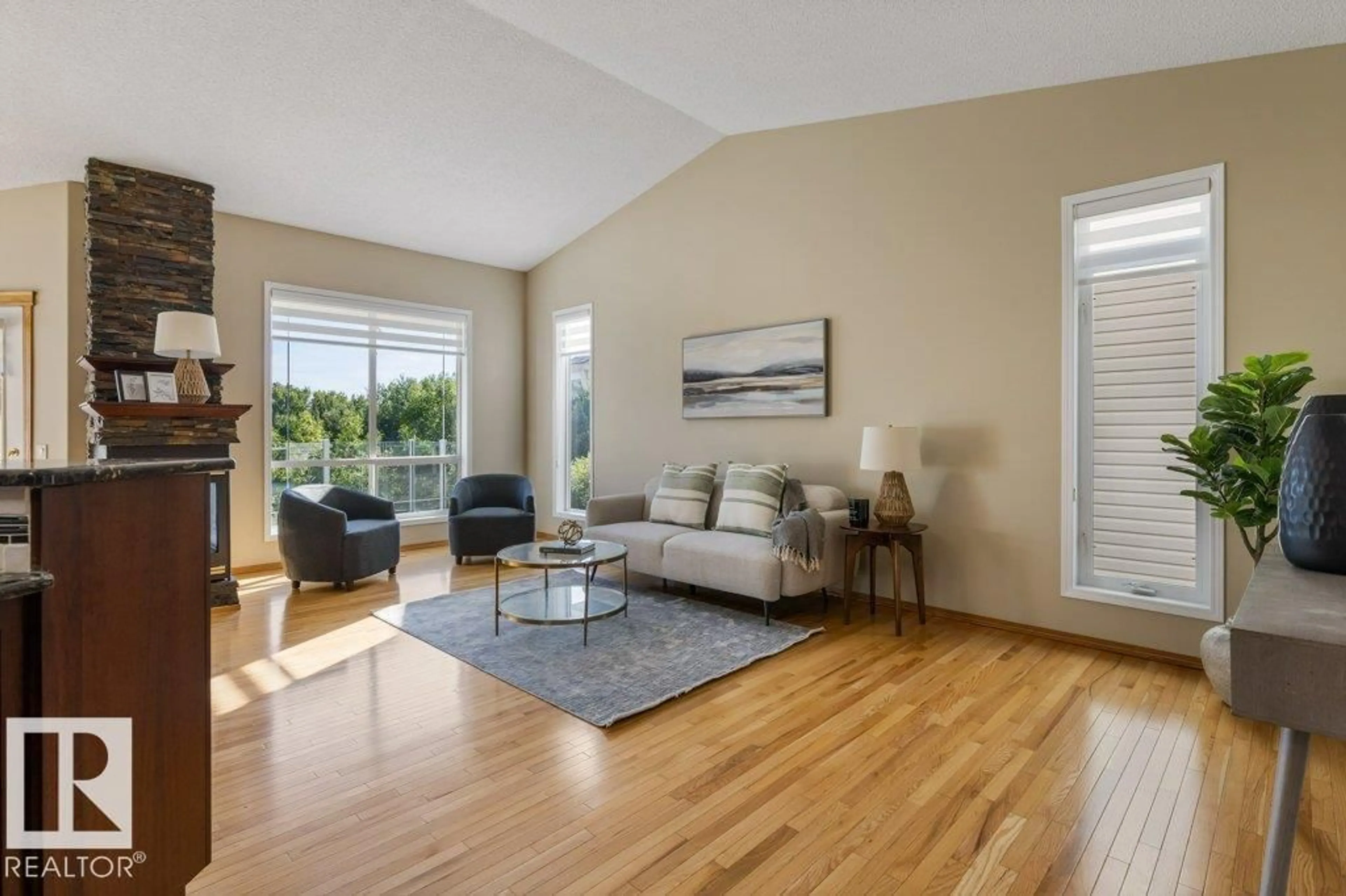 Living room with furniture, wood/laminate floor for 4 - 11 HERITAGE WY, St. Albert Alberta T8N6W3