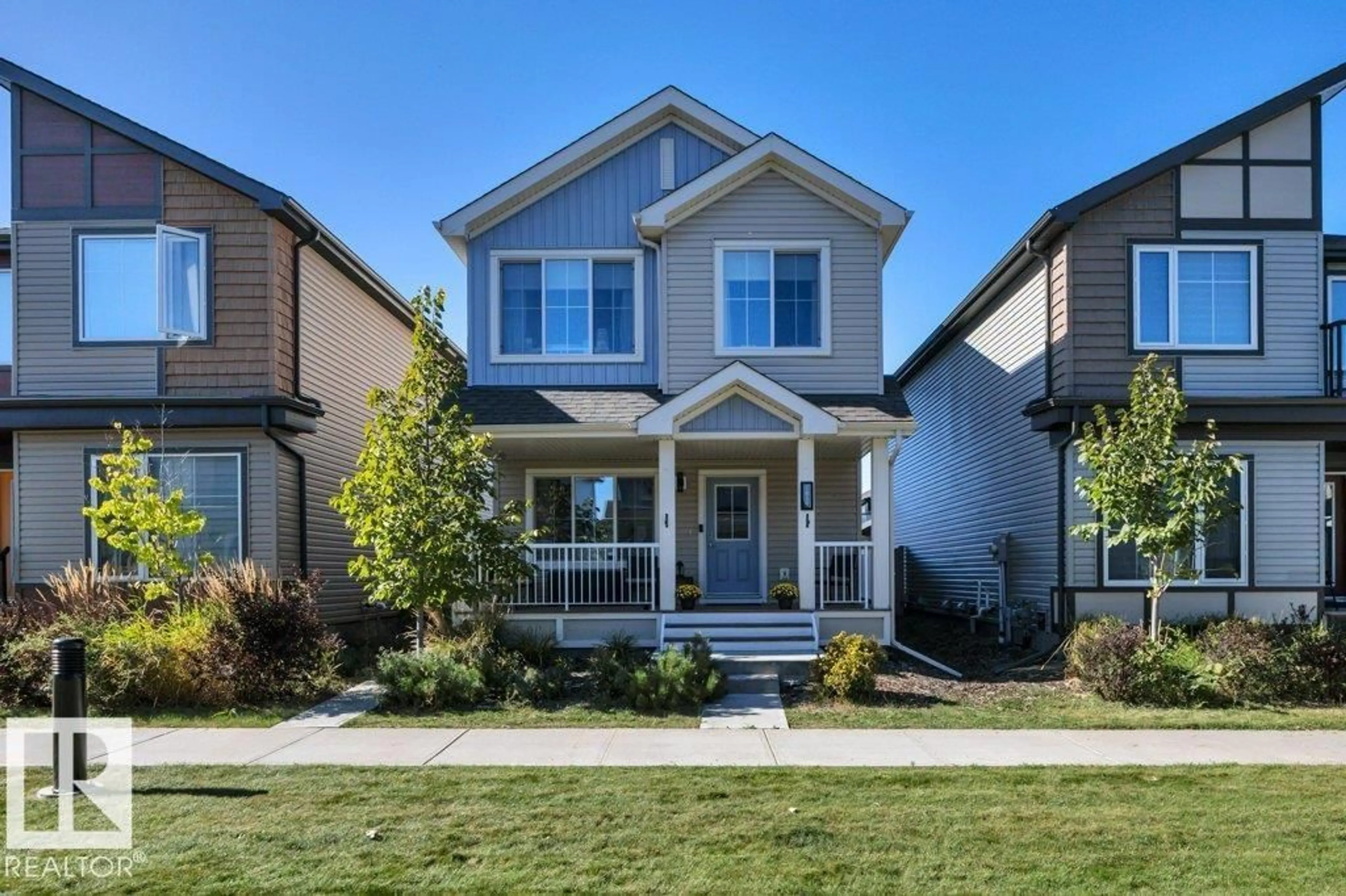 Home with vinyl exterior material, street for NW - 1819 26A ST, Edmonton Alberta T6T2H8