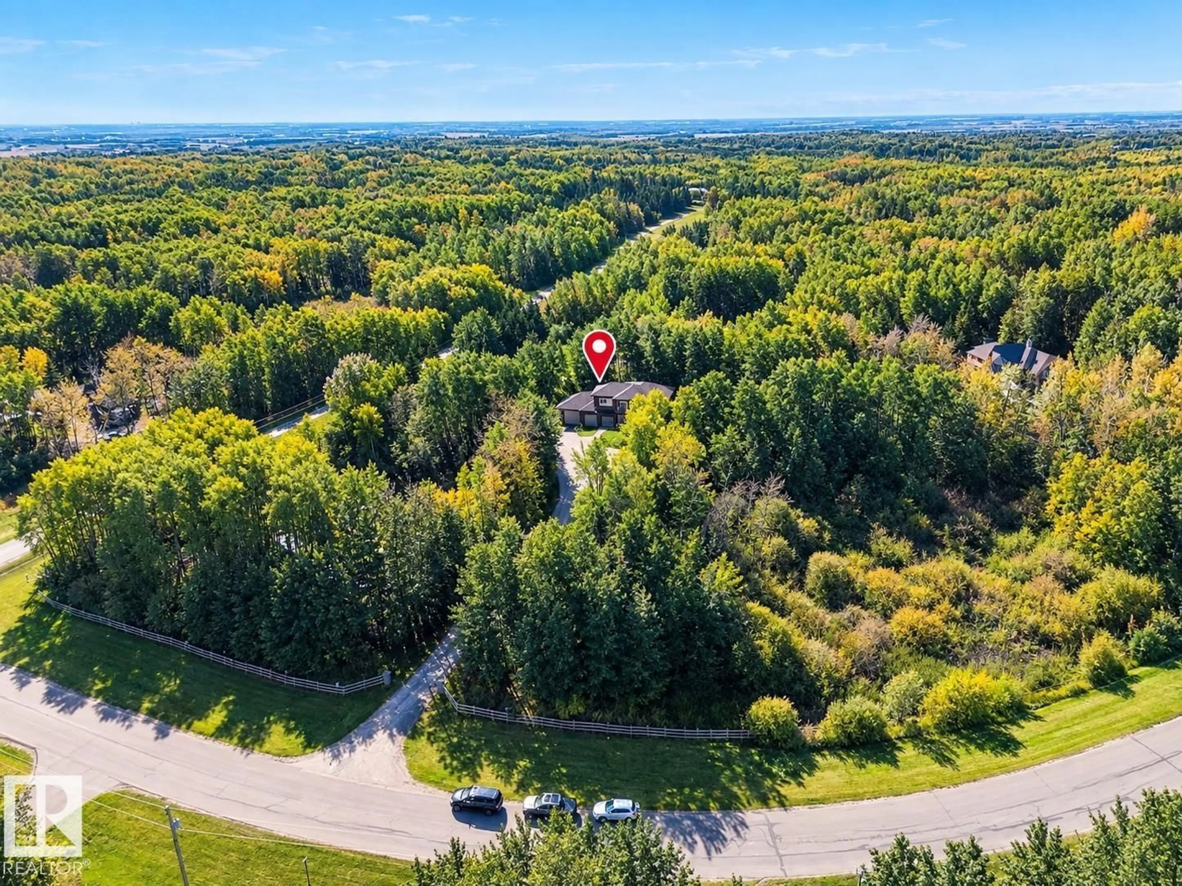 A pic from outside/outdoor area/front of a property/back of a property/a pic from drone, forest/trees view for #3 - 54030 RGE ROAD 275, Rural Parkland County Alberta T7X3V4