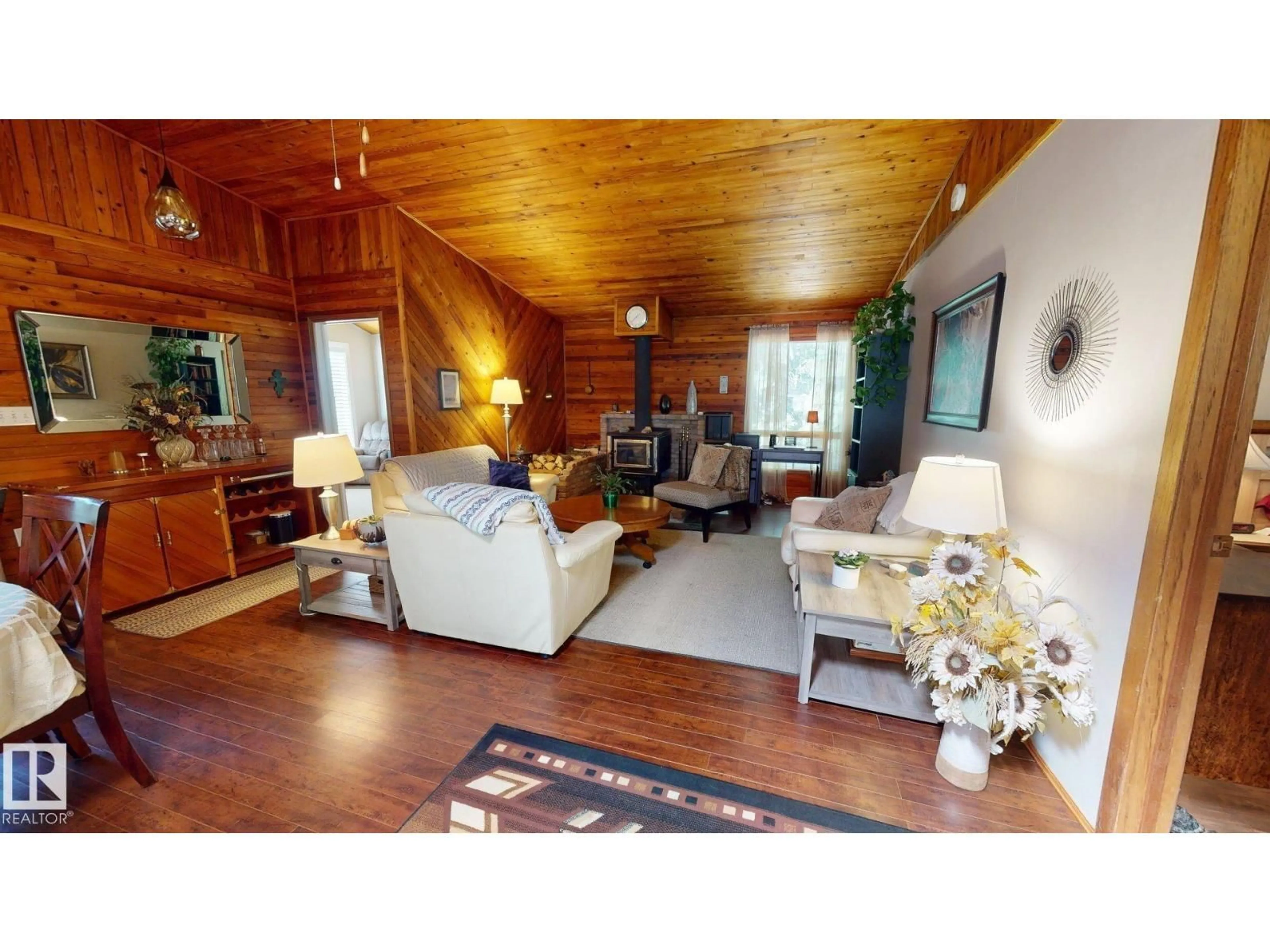 Living room with furniture, wood/laminate floor for 602 HIGHLAND RD, Rural Wetaskiwin County Alberta T0C2C0