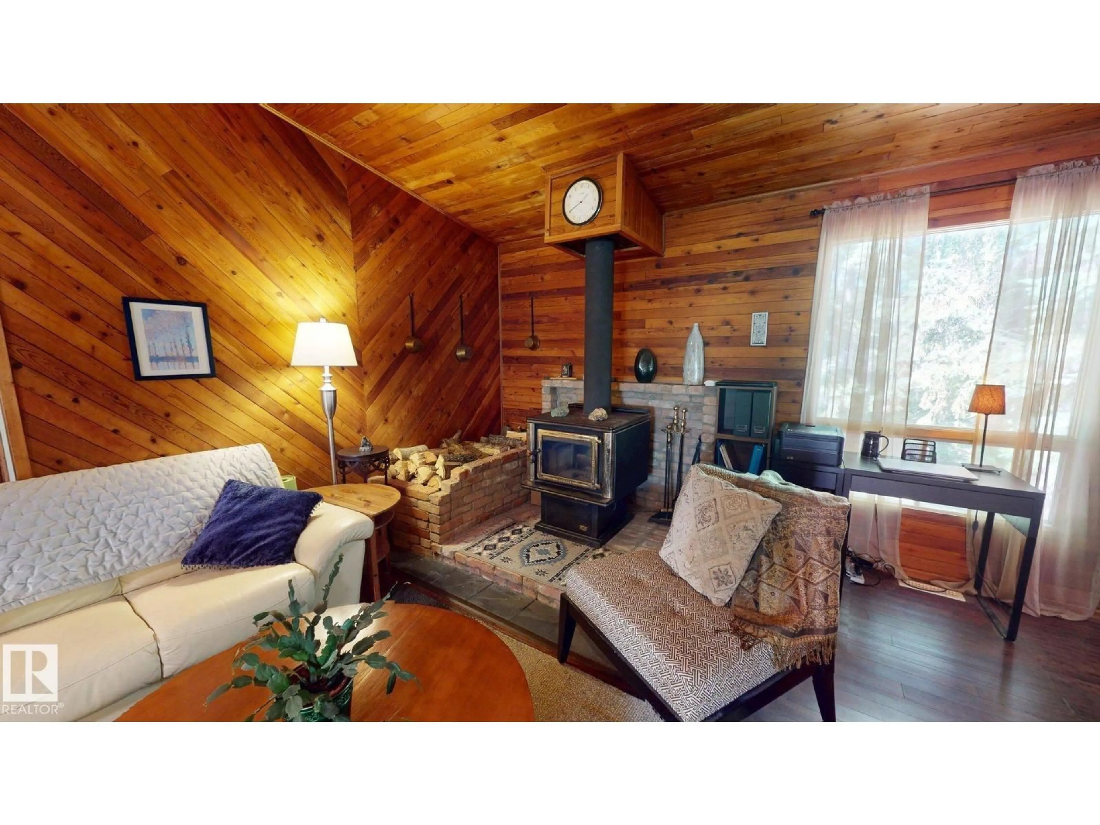 Living room with furniture, wood/laminate floor for 602 HIGHLAND RD, Rural Wetaskiwin County Alberta T0C2C0