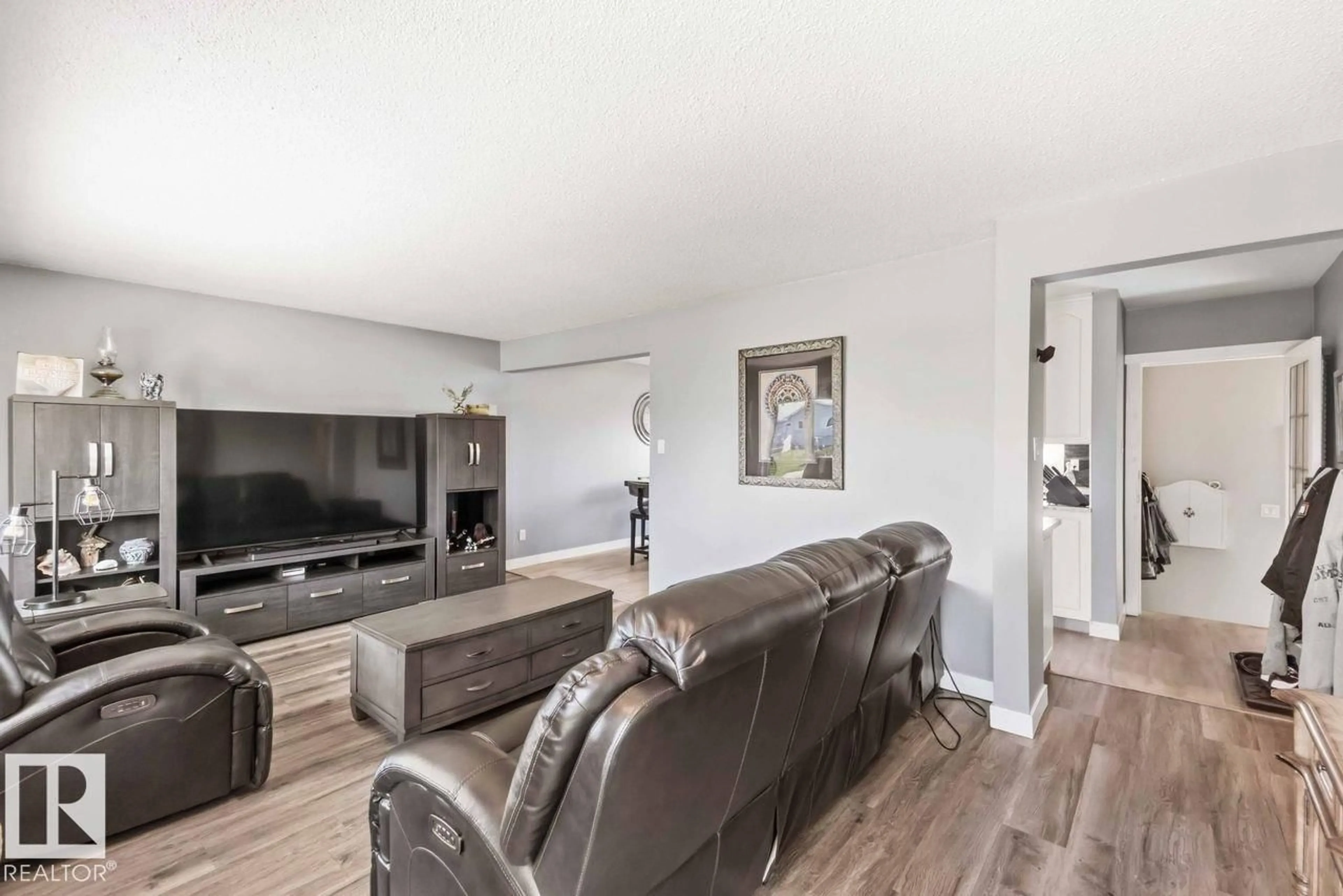 Living room with furniture, wood/laminate floor for 13427 83 STREET, Edmonton Alberta T5E2W9