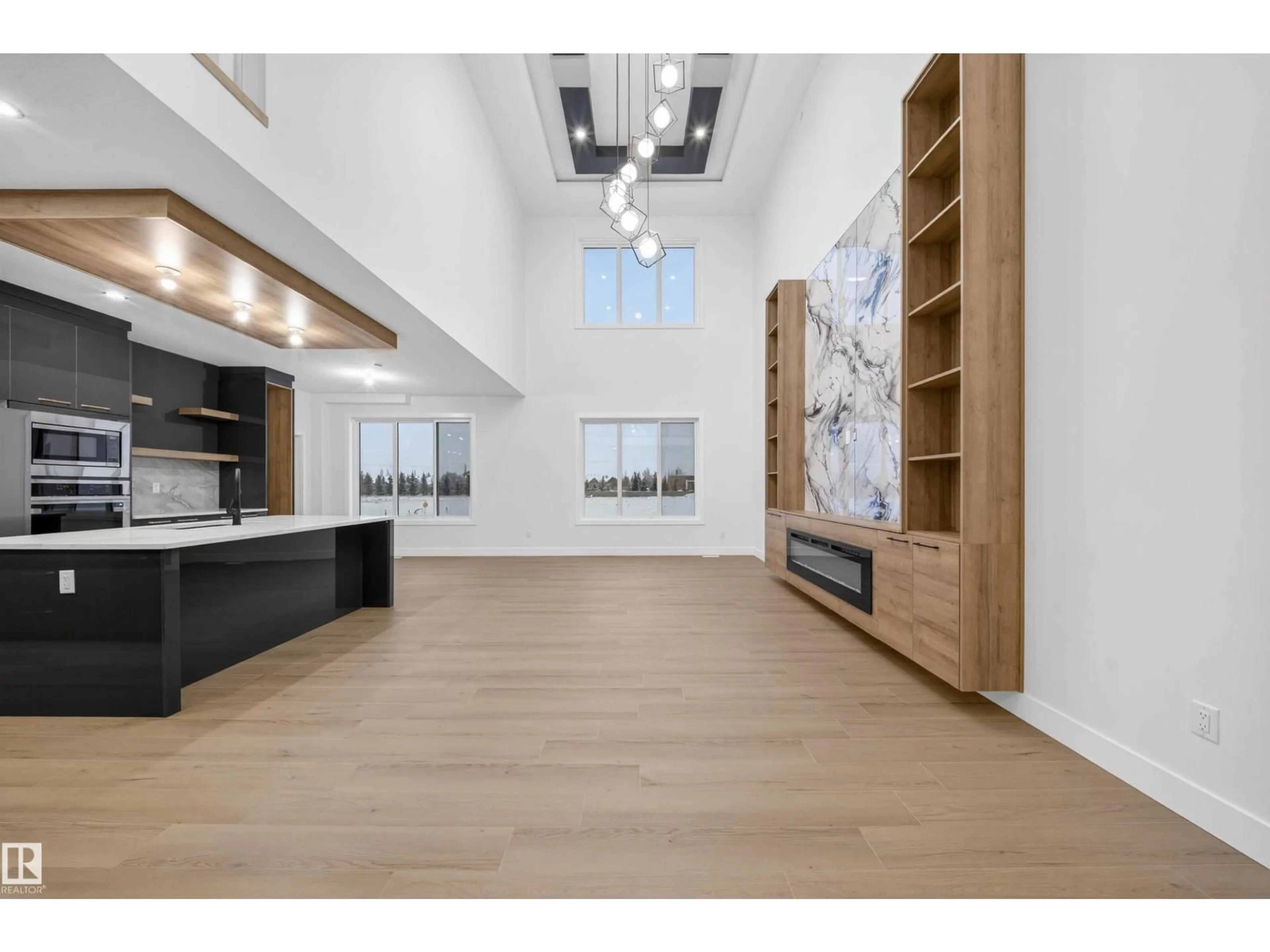 Open concept kitchen, wood/laminate floor for 5922 19 ST, Rural Leduc County Alberta T4X3C4
