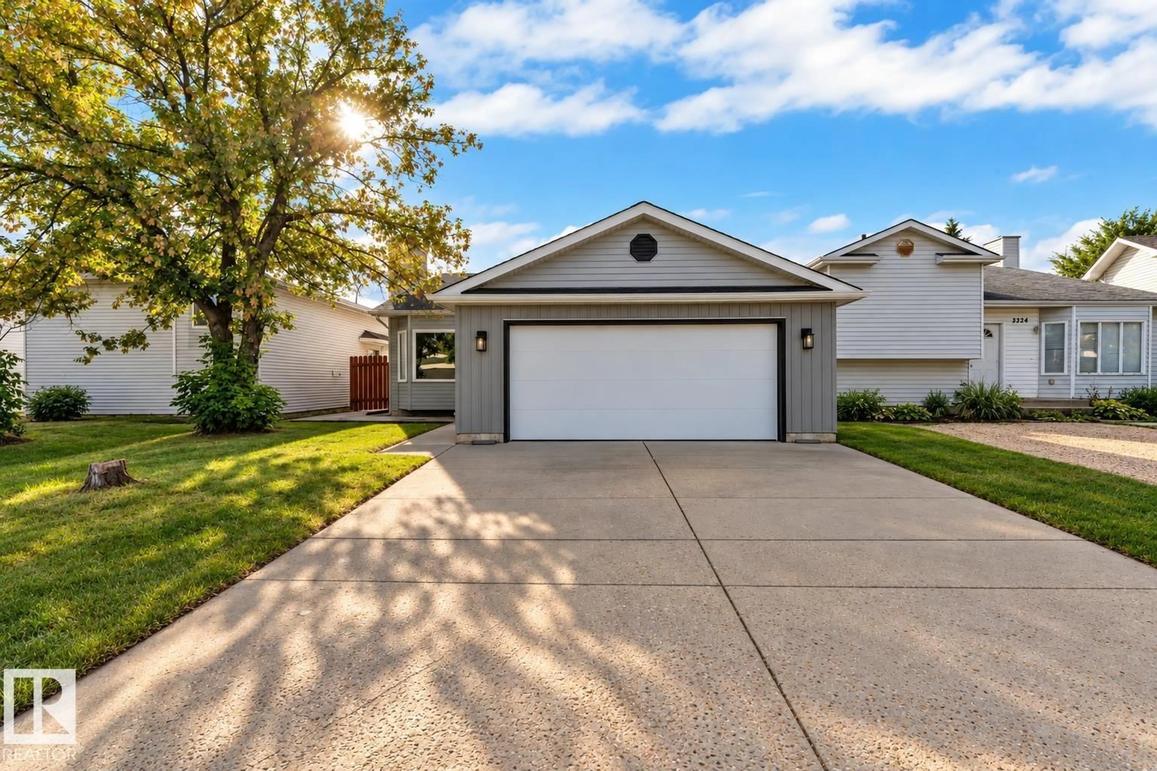 Home with vinyl exterior material, street for 3320 43 ST, Edmonton Alberta T6L6A4