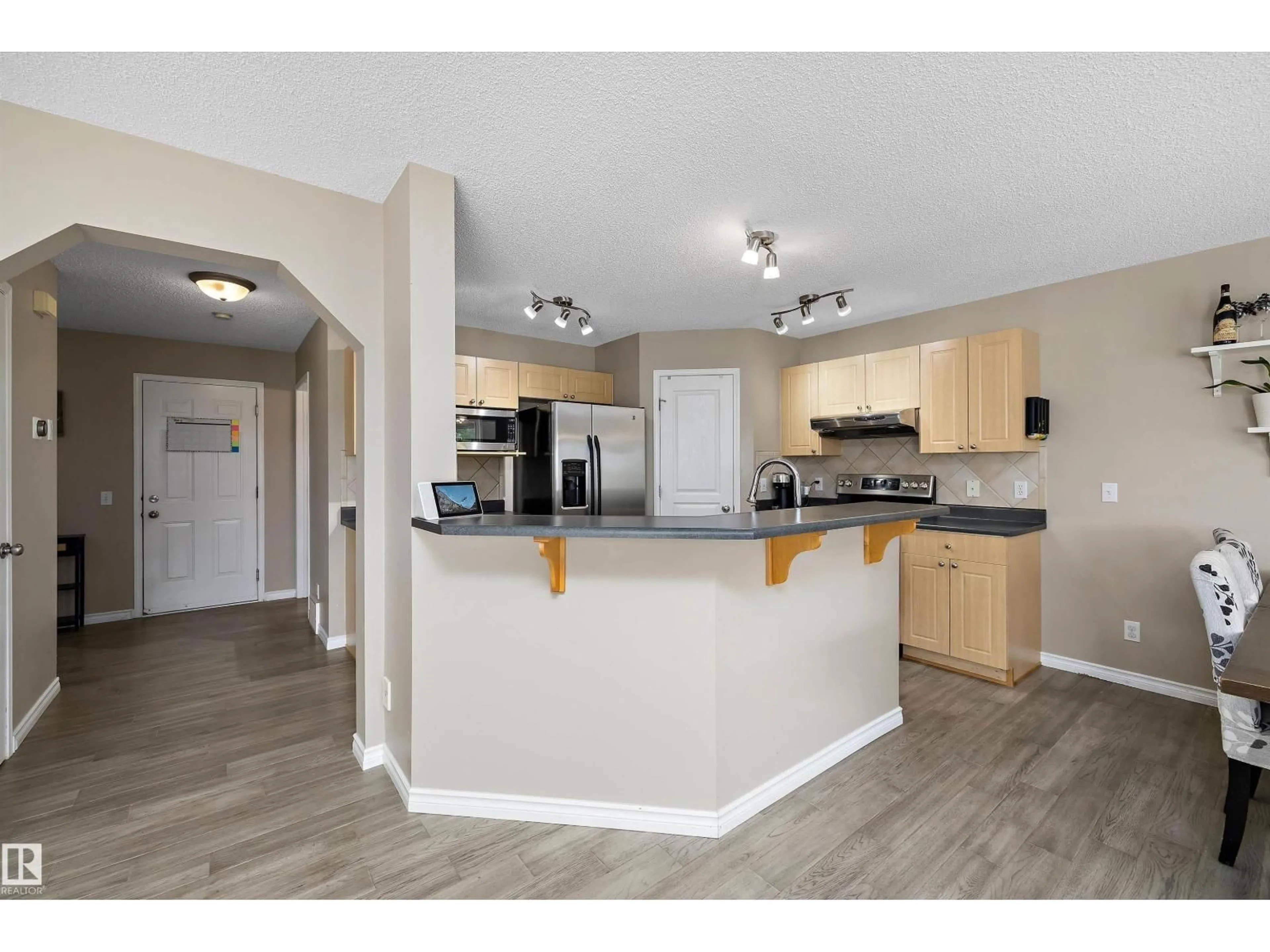 Open concept kitchen, wood/laminate floor for NW - 4616 191 ST, Edmonton Alberta T6M2Y2