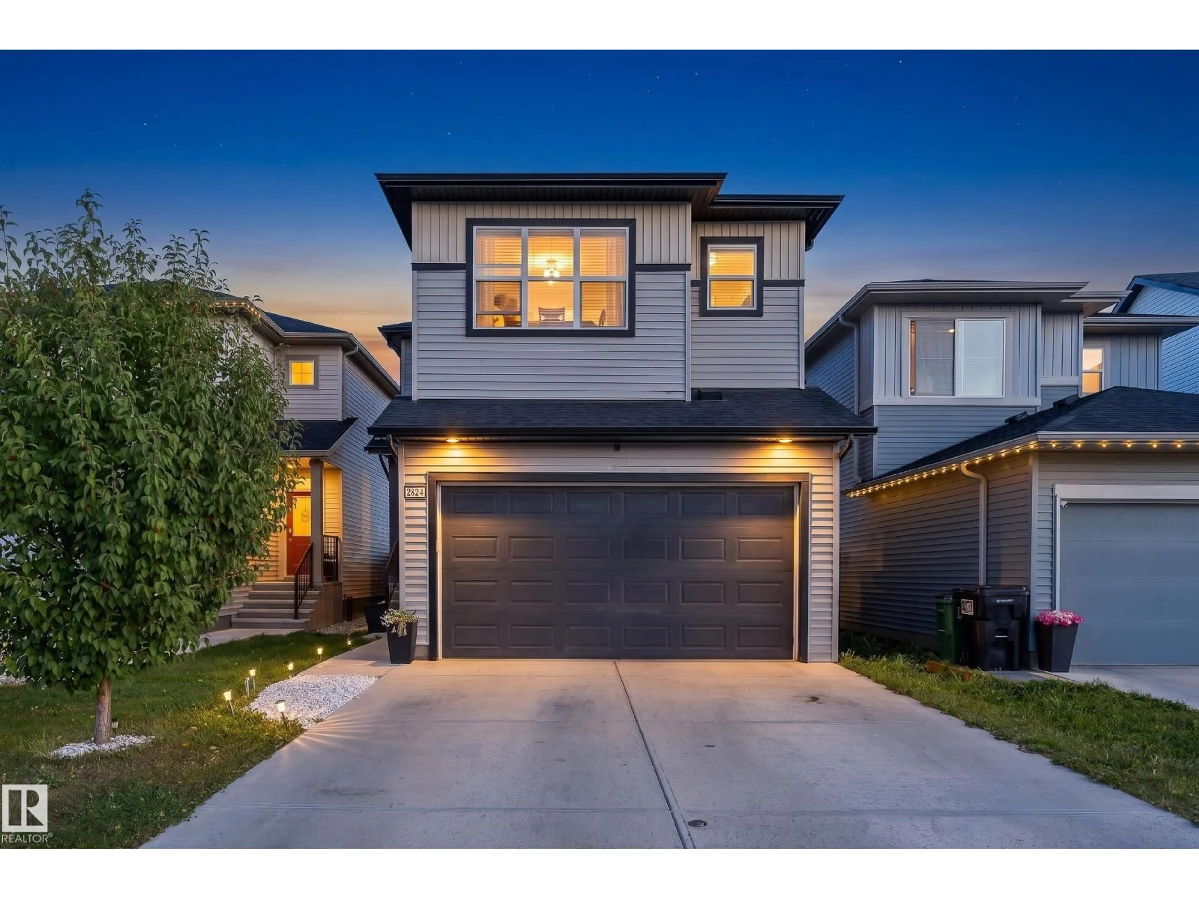 Home with brick exterior material, street for 2824 152 AV, Edmonton Alberta T5Y3Y8