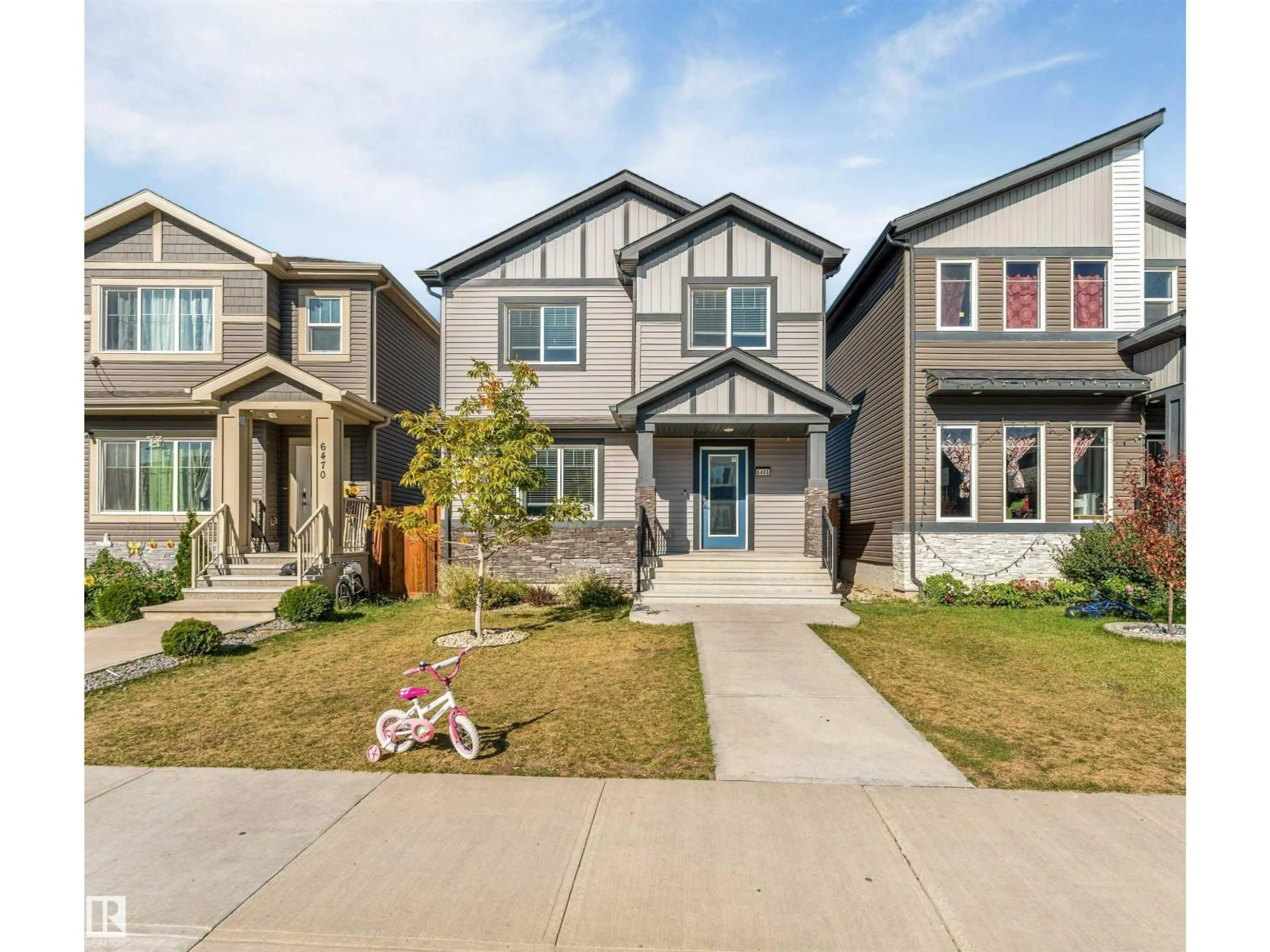 Home with vinyl exterior material, street for 6466 177A AV, Edmonton Alberta T5Y3X2