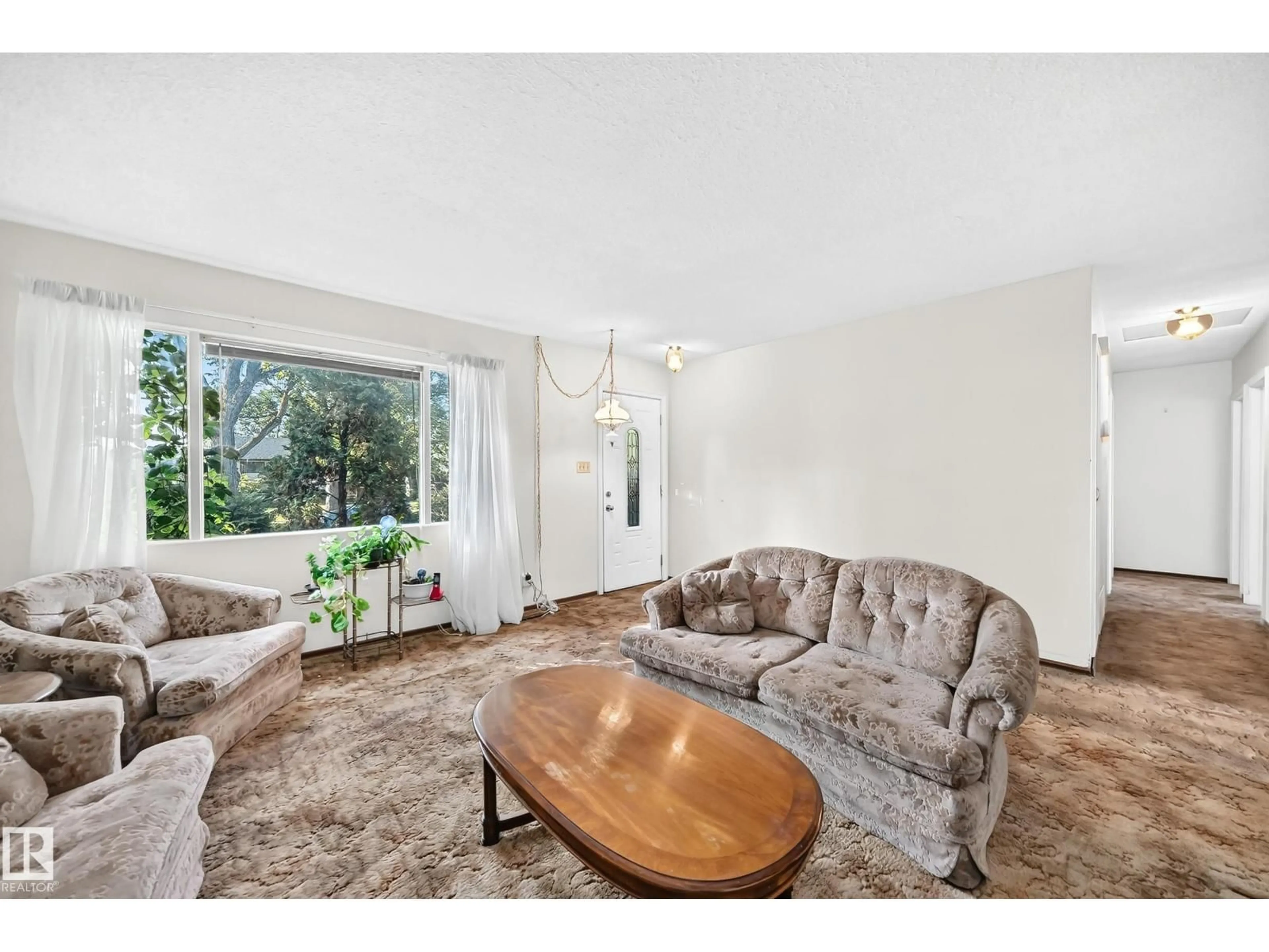 Living room with furniture, unknown for 10528 128 AV, Edmonton Alberta T5E0J3