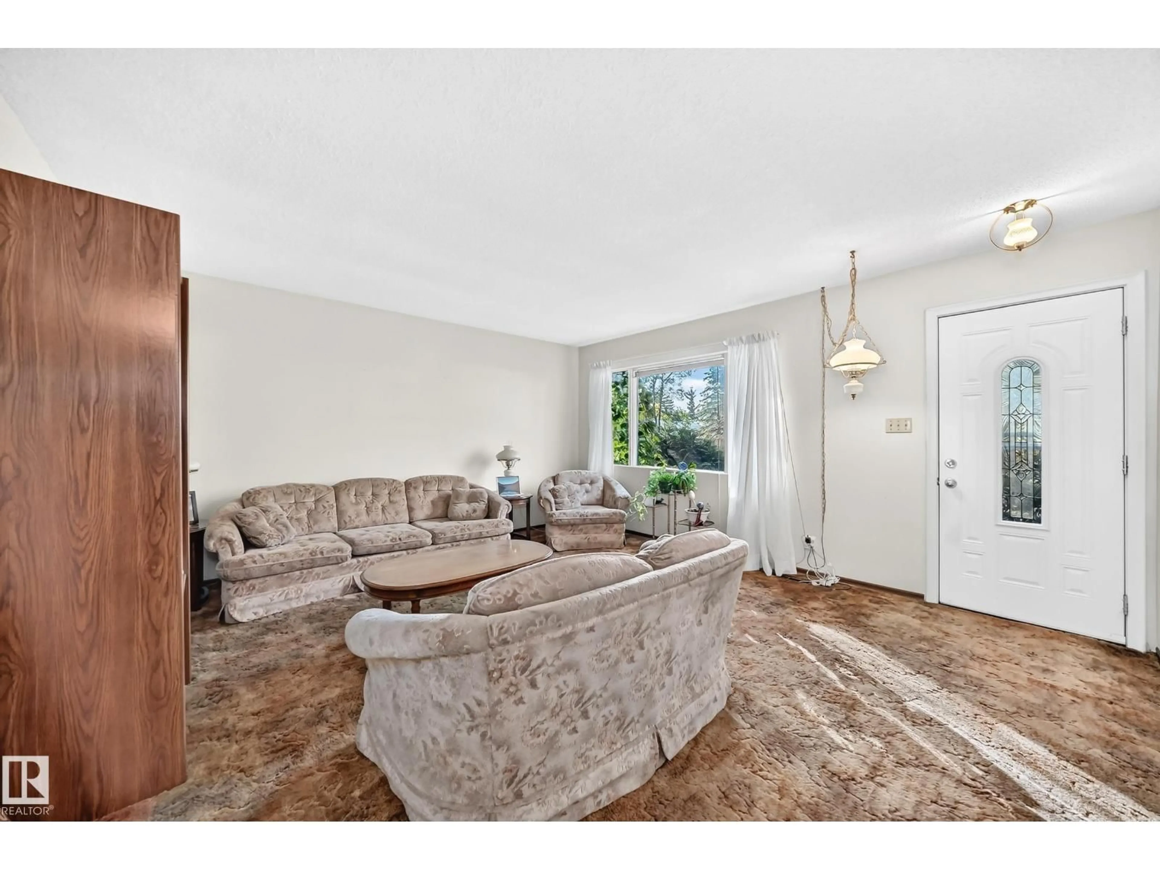 Living room with furniture, unknown for 10528 128 AV, Edmonton Alberta T5E0J3
