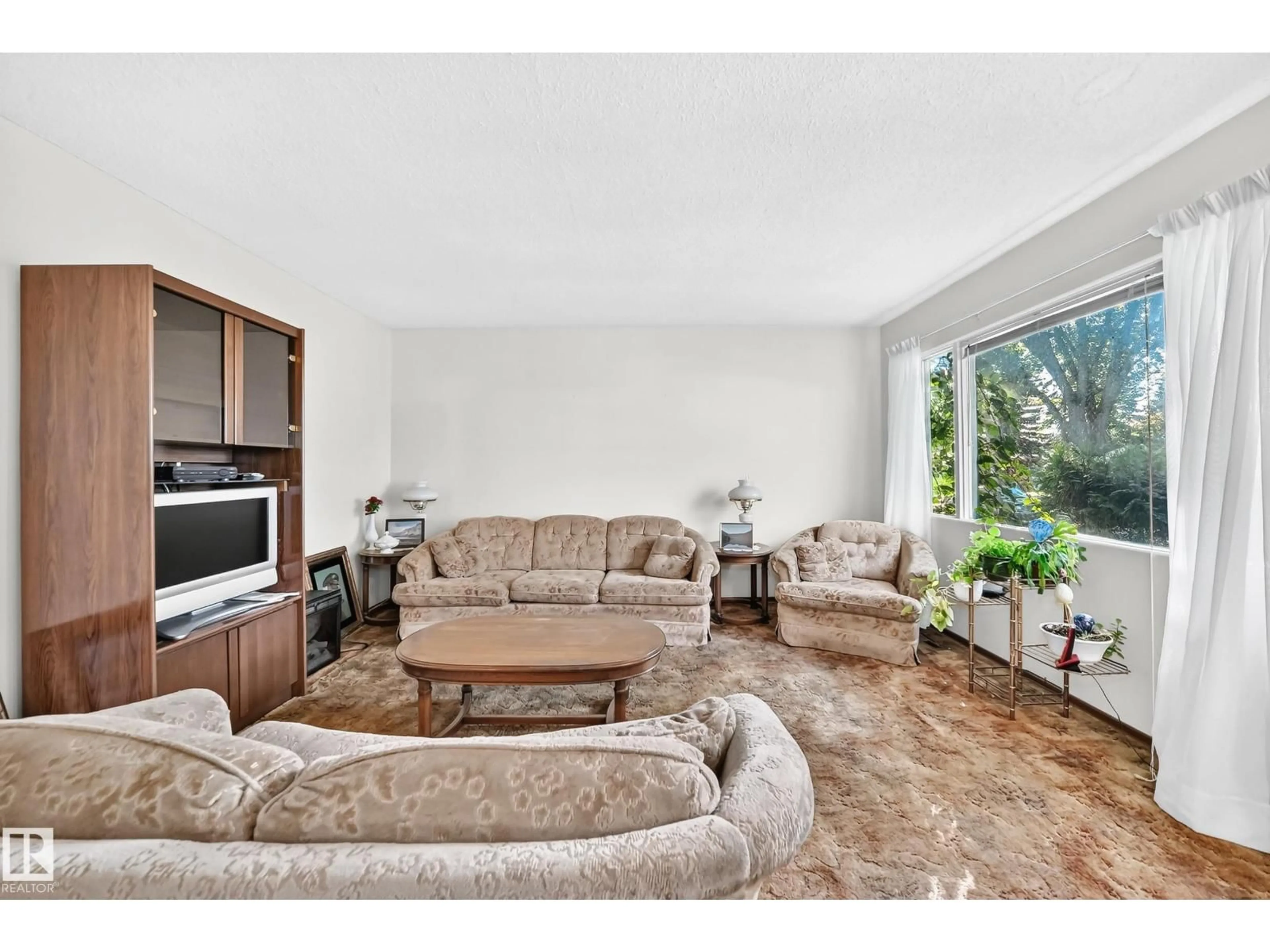 Living room with furniture, unknown for 10528 128 AV, Edmonton Alberta T5E0J3