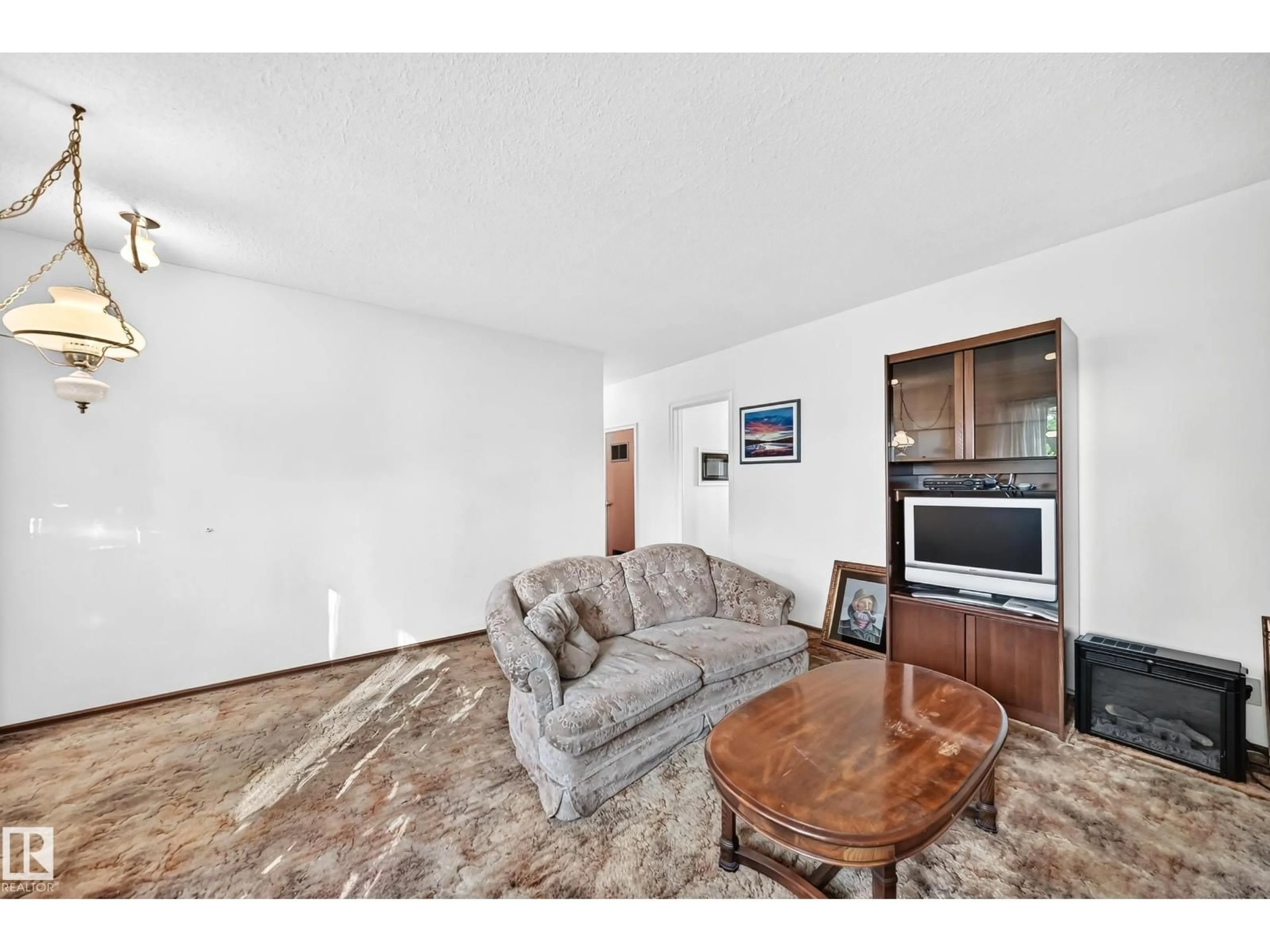 Living room with furniture, unknown for 10528 128 AV, Edmonton Alberta T5E0J3