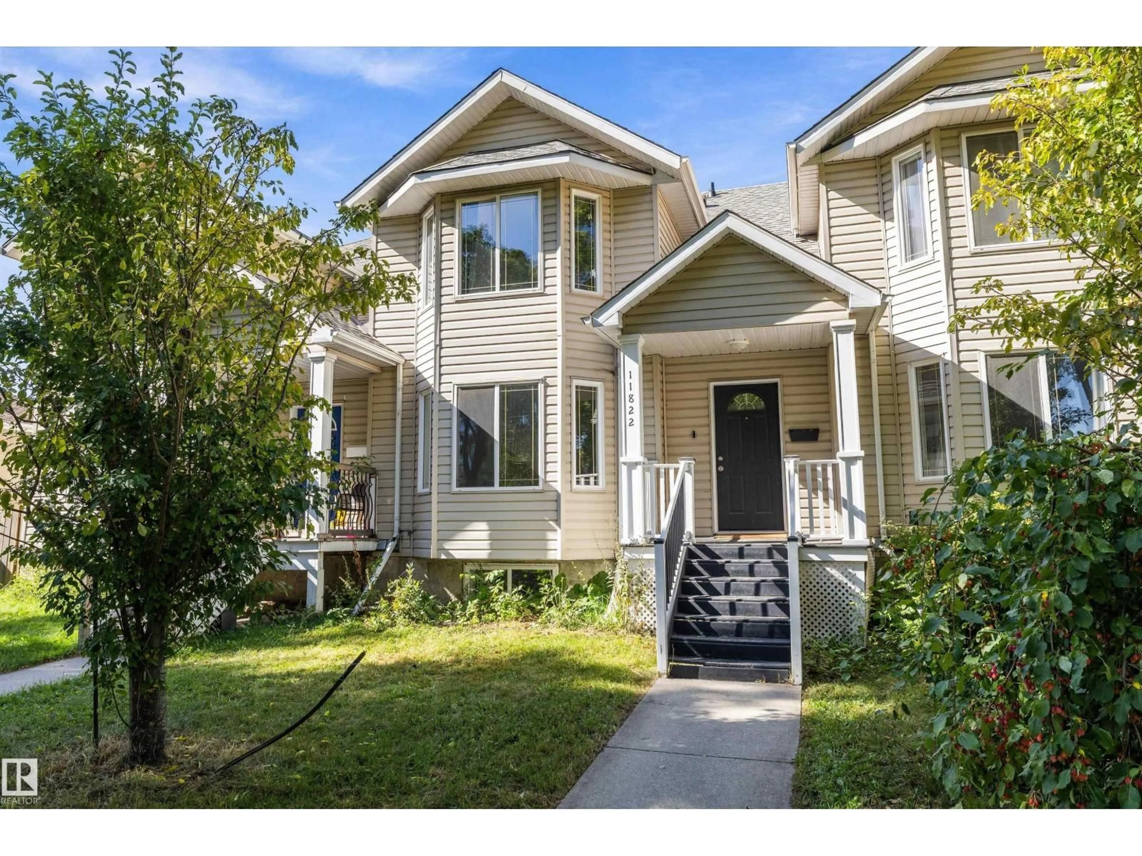 Home with vinyl exterior material, street for 11822 47 ST, Edmonton Alberta T5W2W8