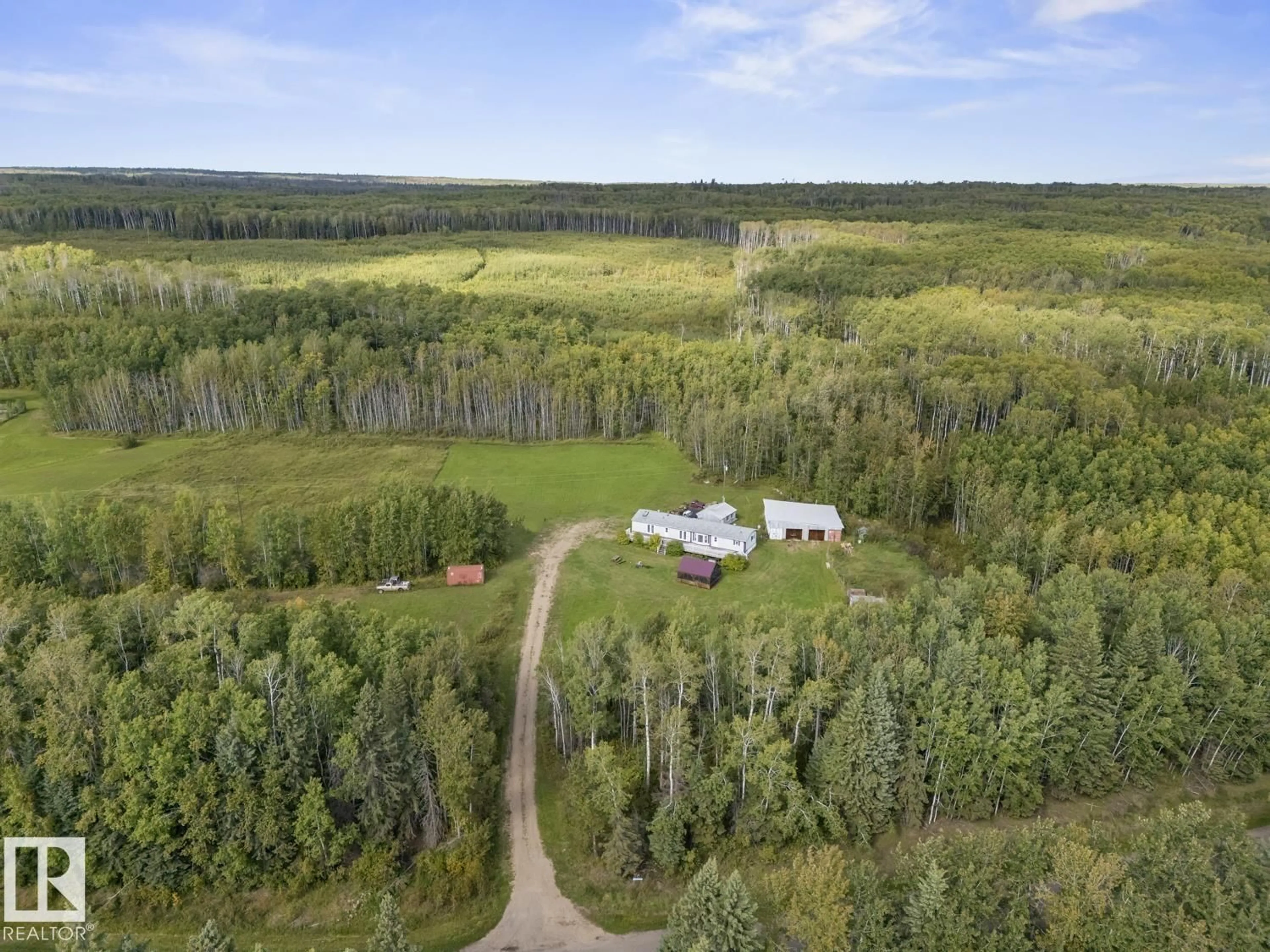 A pic from outside/outdoor area/front of a property/back of a property/a pic from drone, forest/trees view for 43018 TWP RD 643, Rural Bonnyville M.D. Alberta T9M1P3