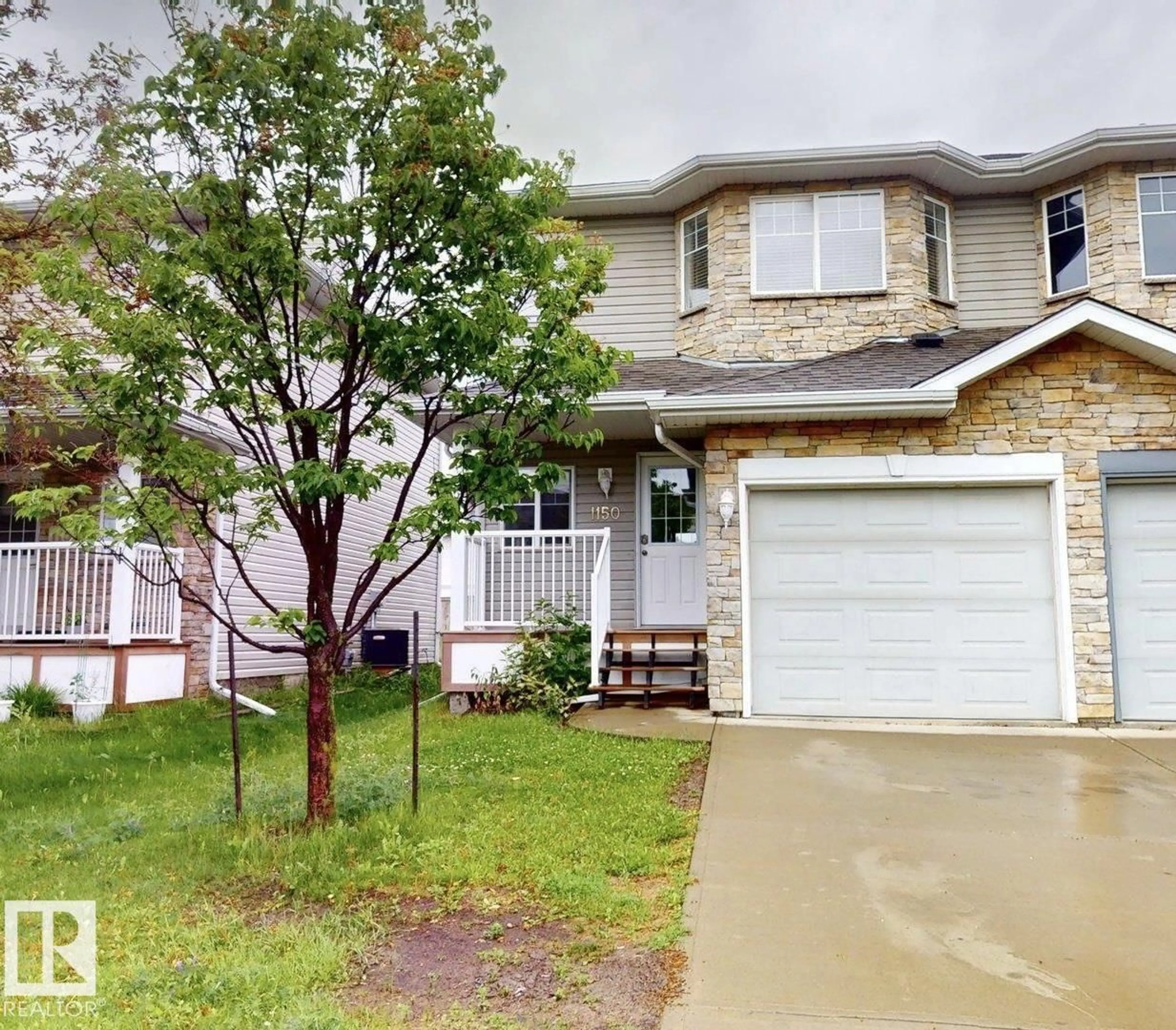 Home with vinyl exterior material, street for NW - 1150 37B AV, Edmonton Alberta T6T0E6