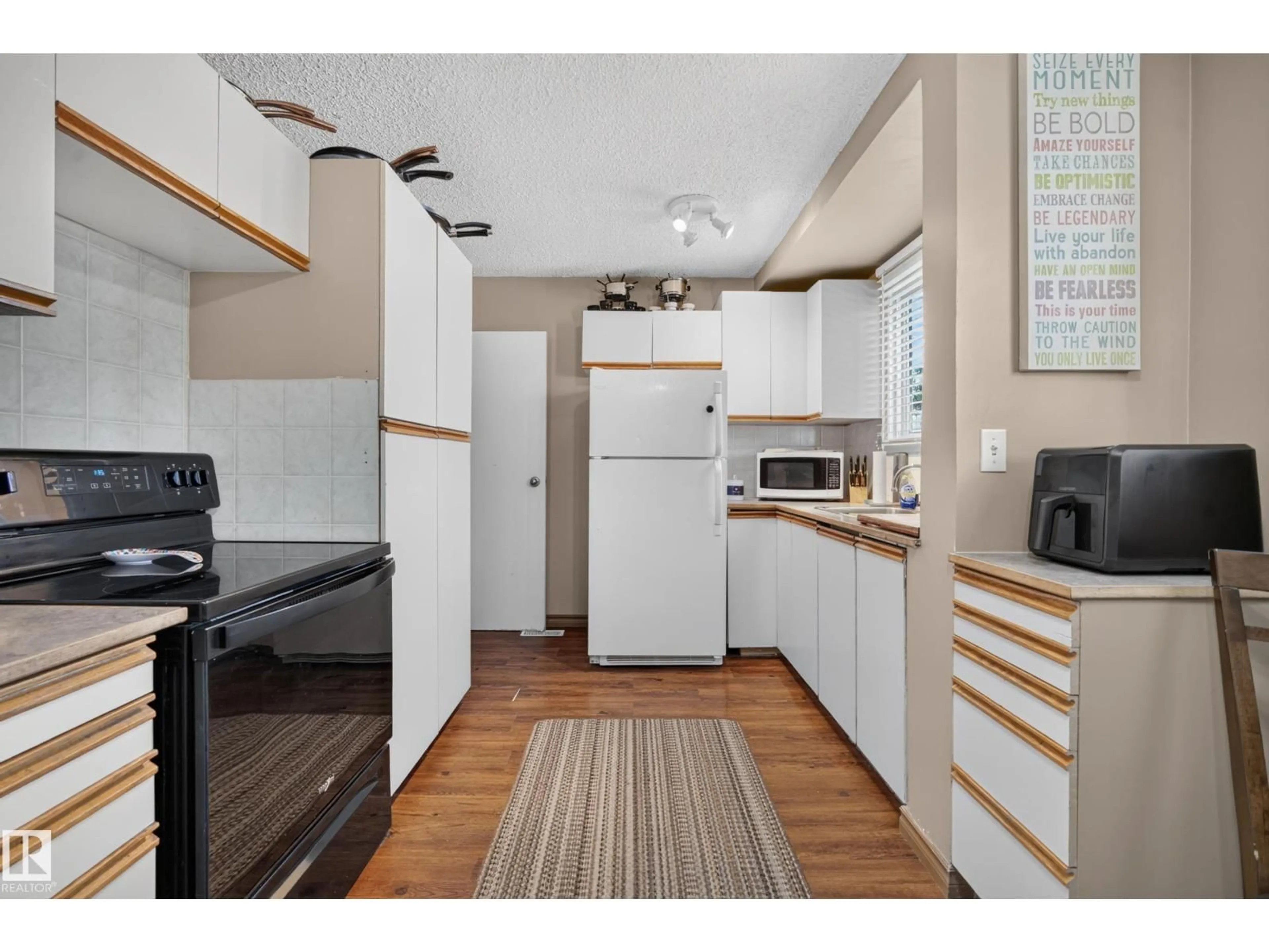 Standard kitchen, wood/laminate floor for #142 - 5231 51 ST, Bon Accord Alberta T0A0K0