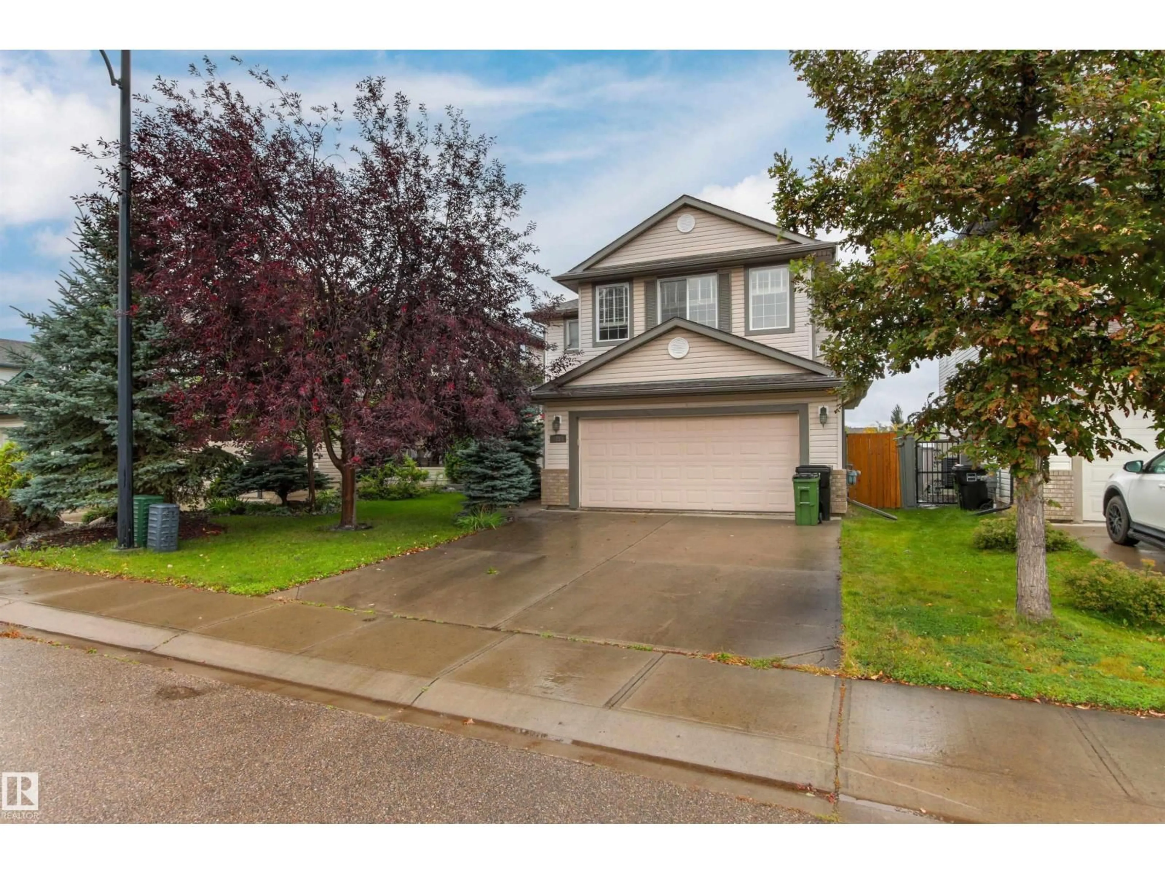 Home with vinyl exterior material, street for NW - 5214 205 ST, Edmonton Alberta T6M2Y6