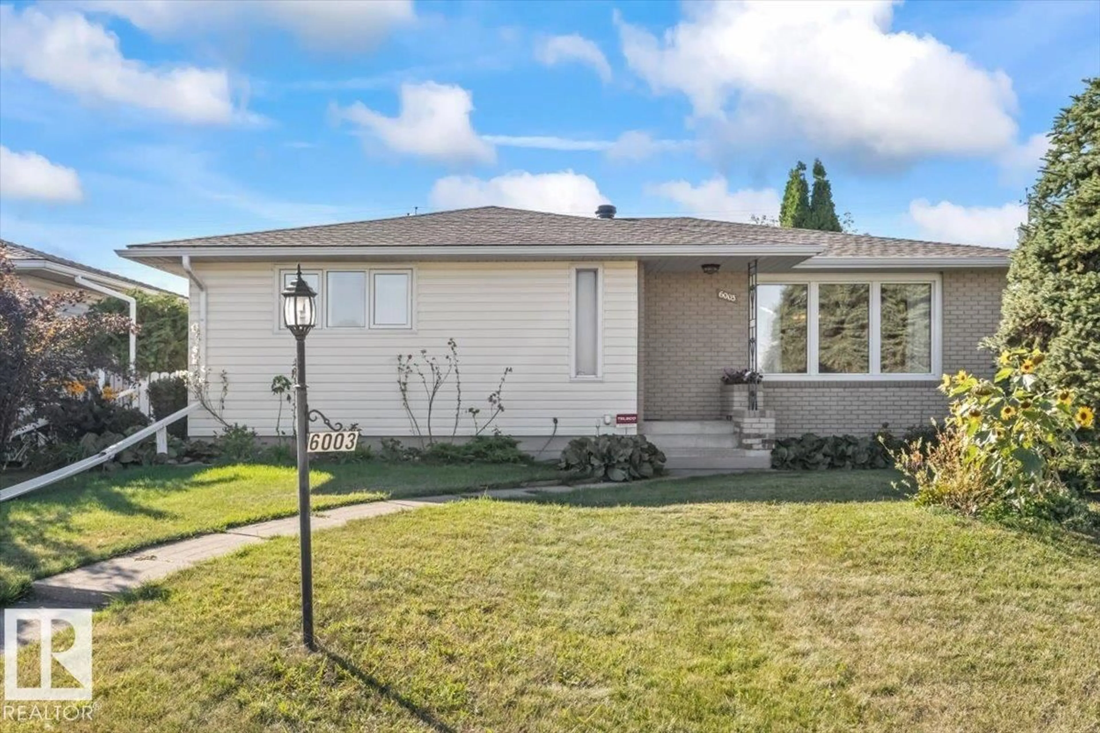 Home with vinyl exterior material, street for NW - 6003 95 AV, Edmonton Alberta T6B1A4