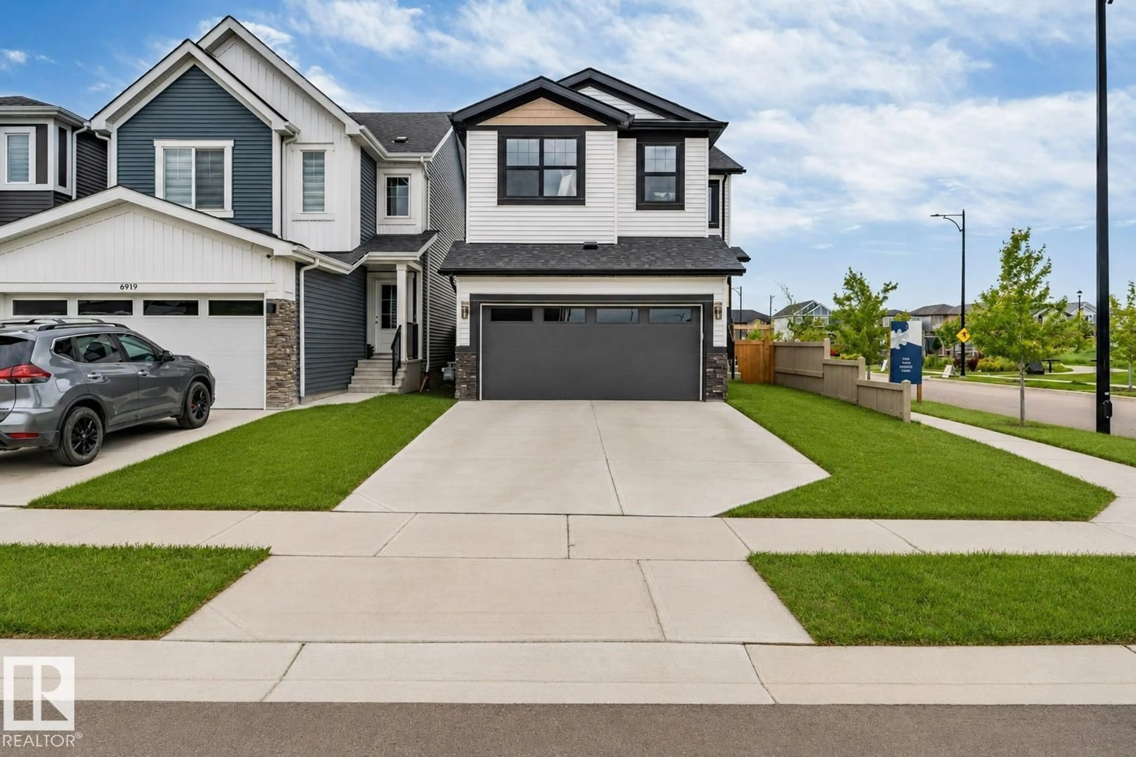 Home with vinyl exterior material, street for 6921 54 AV, Beaumont Alberta T4X2Z7
