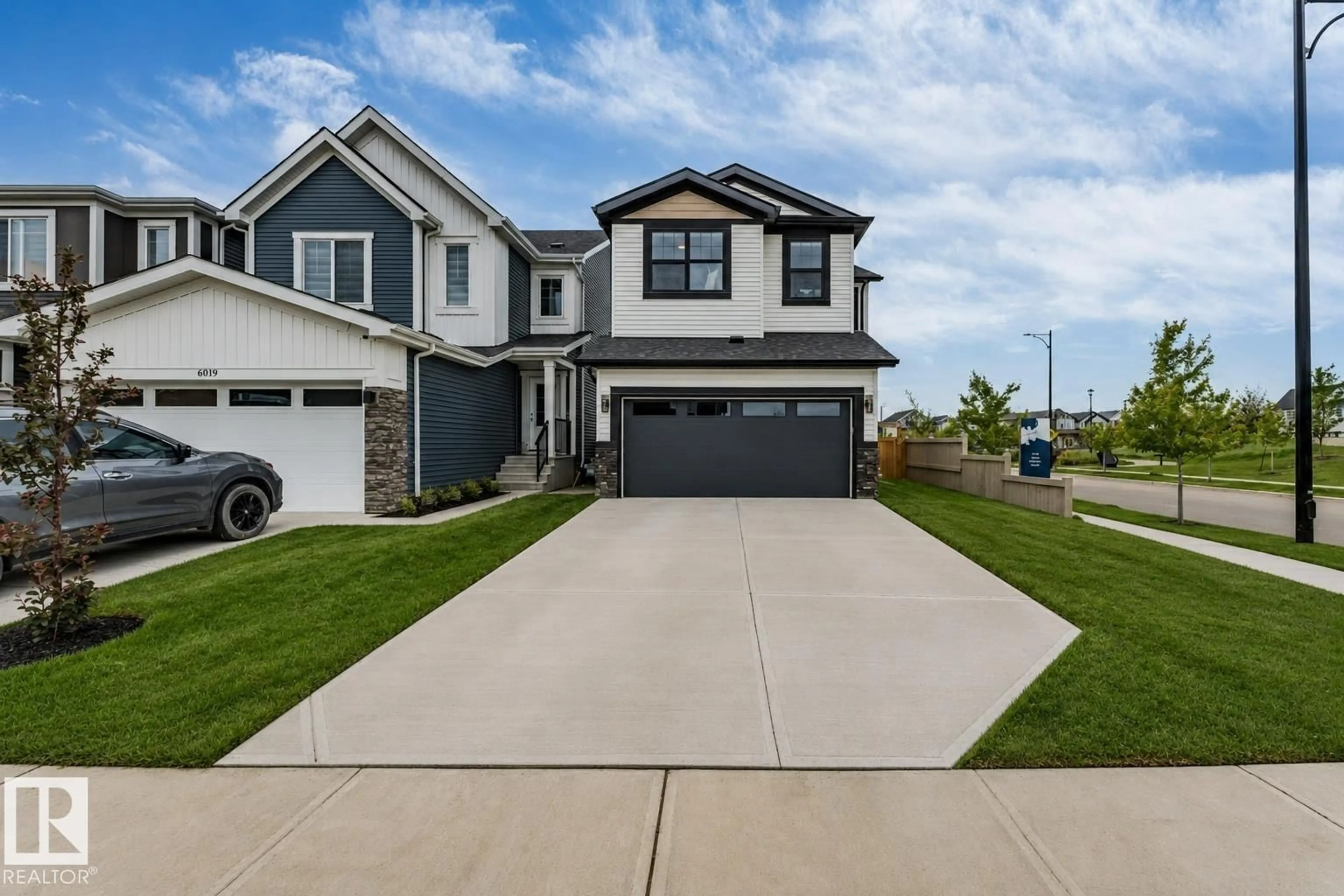 Home with vinyl exterior material, street for 6921 54 AV, Beaumont Alberta T4X2Z7