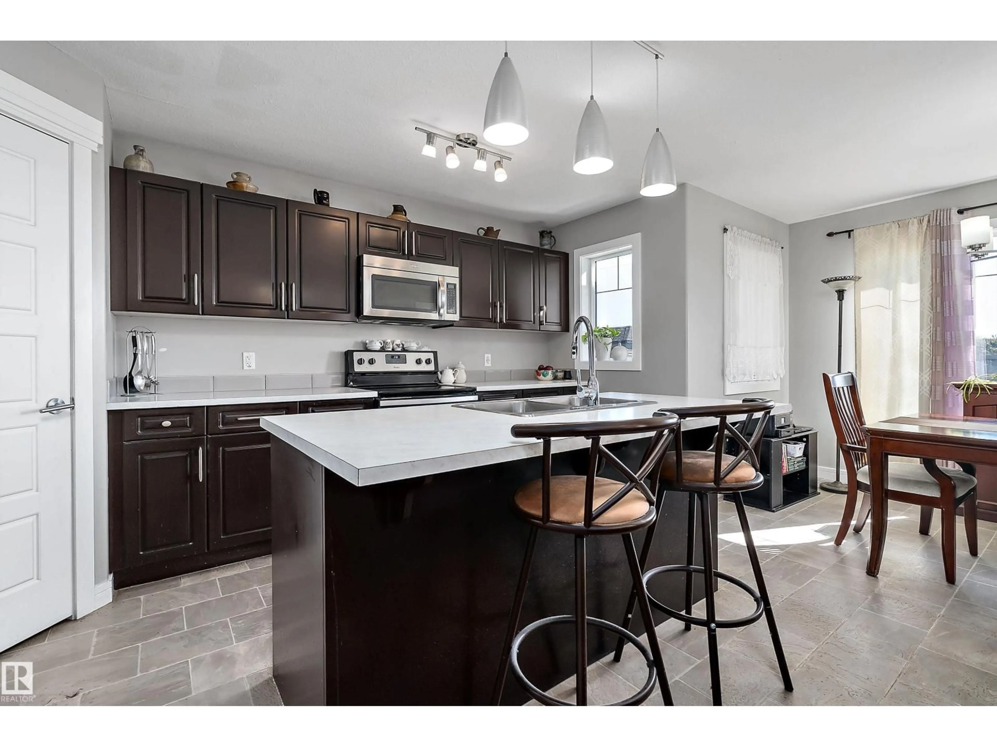 Open concept kitchen, ceramic/tile floor for 7 SANDALWOOD PL, Leduc Alberta T9E1C2