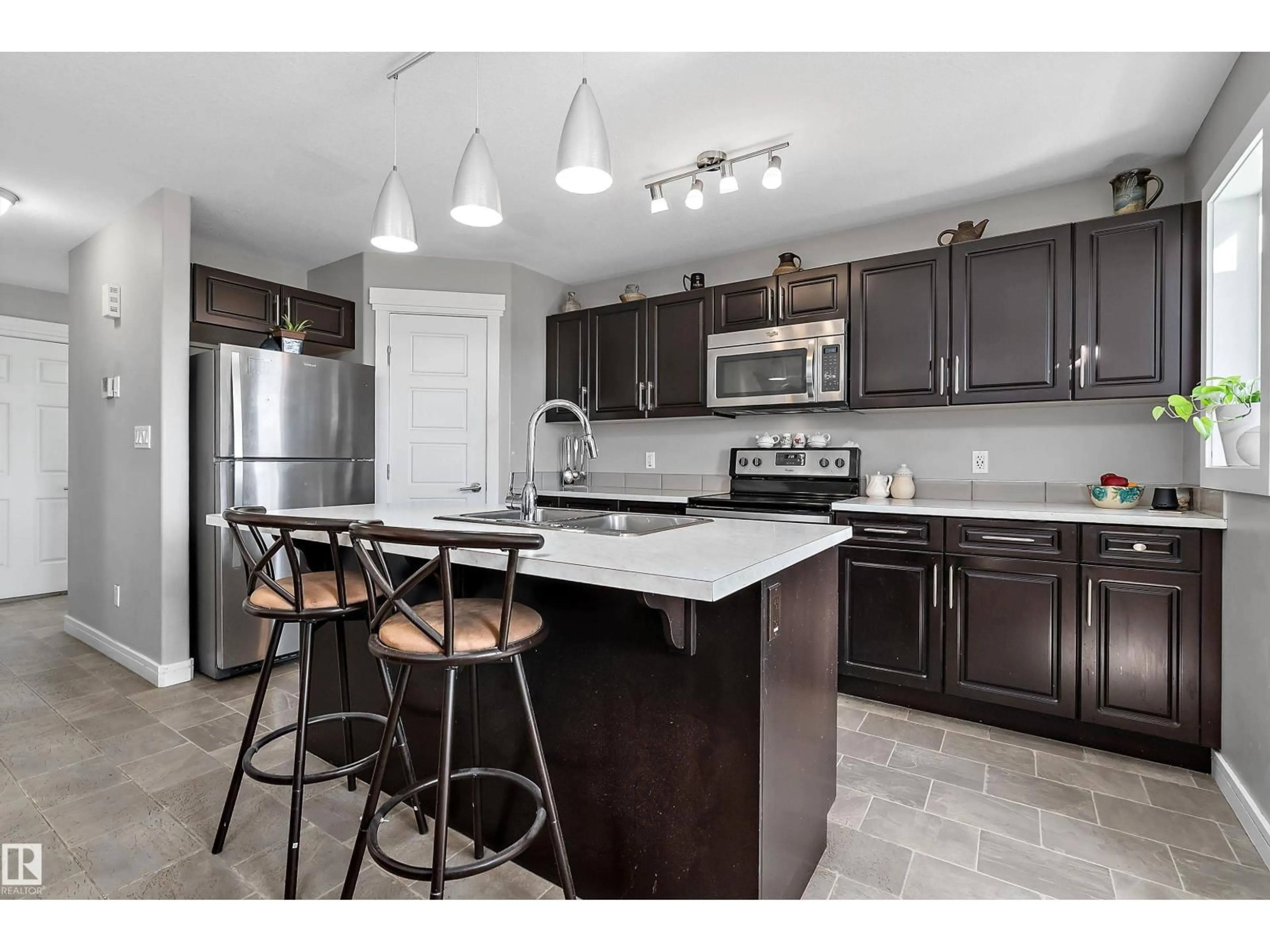 Open concept kitchen, ceramic/tile floor for 7 SANDALWOOD PL, Leduc Alberta T9E1C2